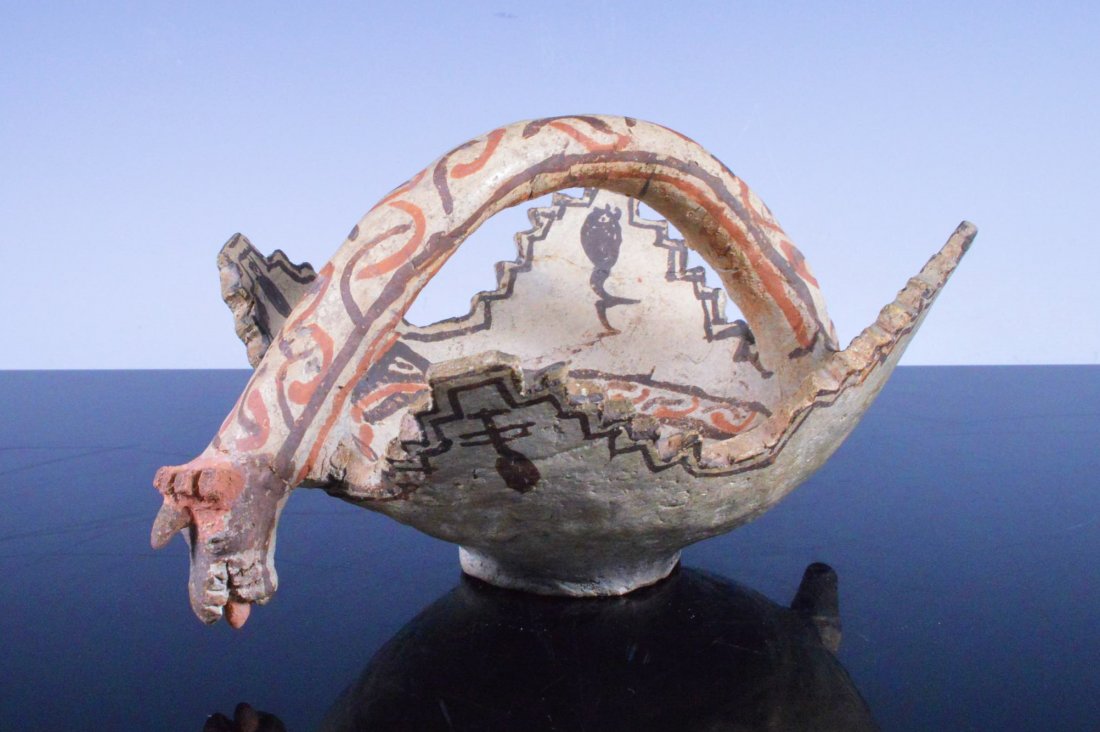 Zuni Polychrome Ceremonial Kiva Bowl w/: Culture: Native American Tribe: Zuni Pueblo Date: Ca. 1900 Size: 7 inches diameter X 4 inches tall Description: A Zuni Polychrome Ceremonial Kiva Bowl, polychrome painted with splayed frog in center a