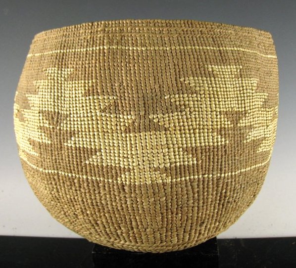 Hupa Twined Basketry Food Bowl, Old: Hupa twined basketry food bowl / mush bowl. Hazel rod warp and Connifer root weft, with Bear Grass overlay. Early piece. Lack of wear indicates use as storage basket for dried goods. Origin: Native Am