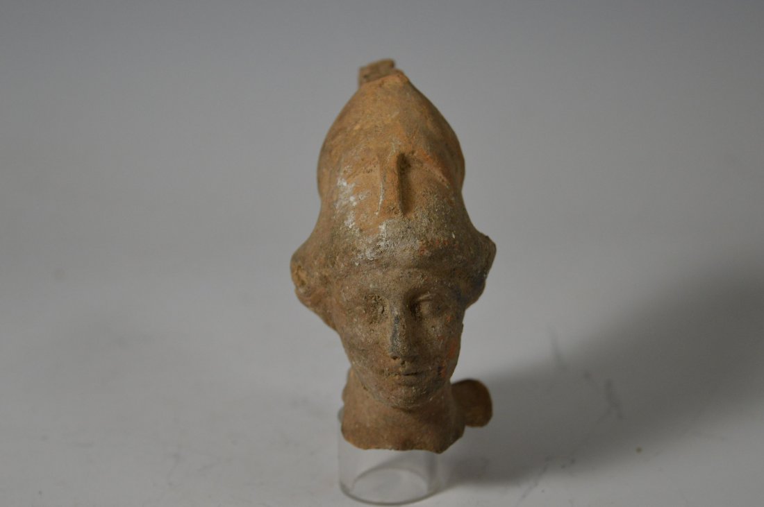 Greek / Roman head and helmet: An ancient Greek / Roman head and helmet fragment. (200 BC - 300 AD) Terracotta, well detailed head with Greek helmet. Provenance: Ex- John Hibner, acquired in Turkey during military service 1960's 3 