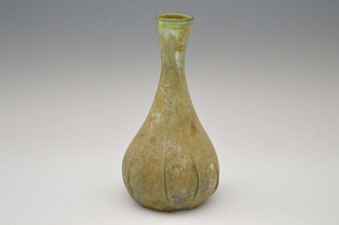 A lovely Green Roman glad vase with tailings: A lovely Green Roman glass vase with tailings. 200 BC 5.5 inches tall. Provenance: Ex- John Hibner, acquired in Turkey during military service 1960's.