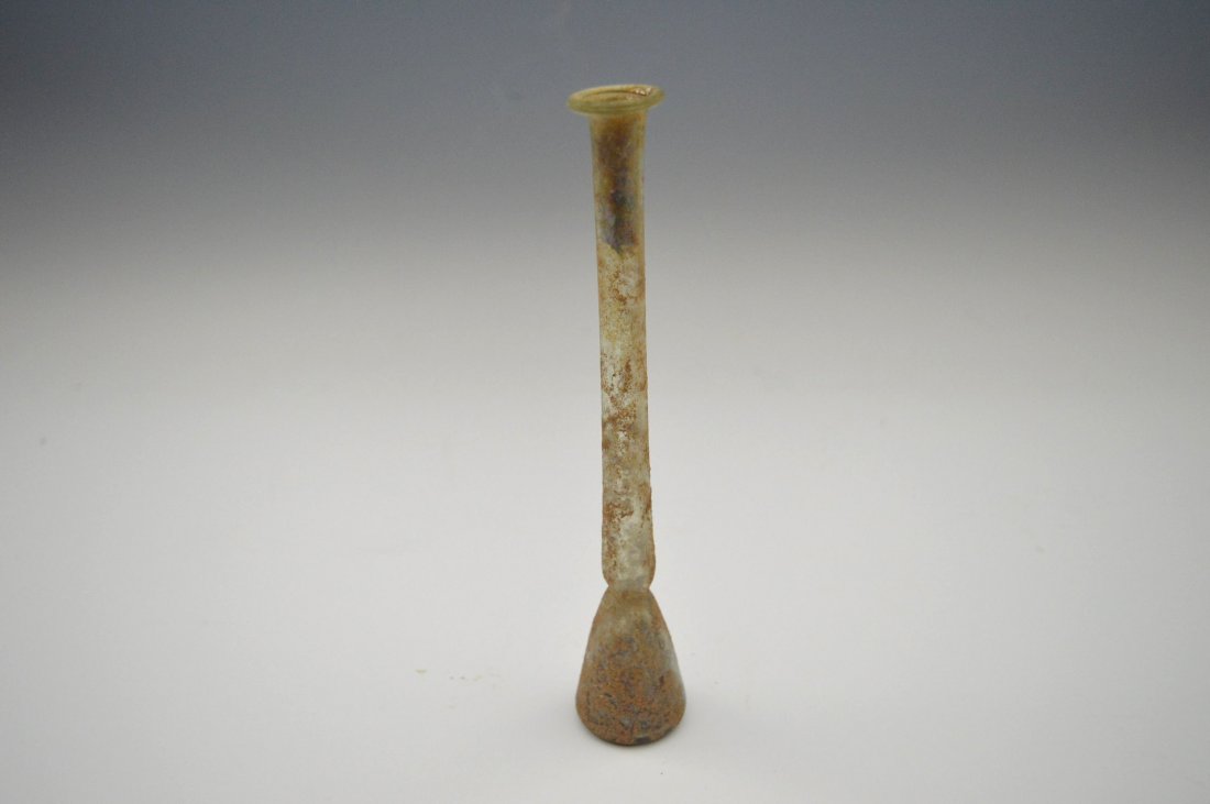 A tall of Roman green glass vial (1 of 2)