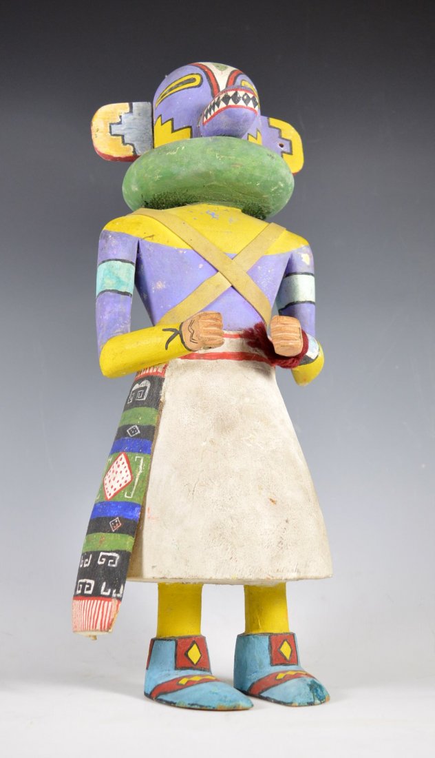 Kachina / Katsina Doll, 1940's to '50's: Tall & stately mid-20th Century Kachina / Katsina doll, Hopi Pueblo. Carved from Cottonwood, with carved side sash and accurately painted moccasins. Leather straps across upper torso, Lizard painted o