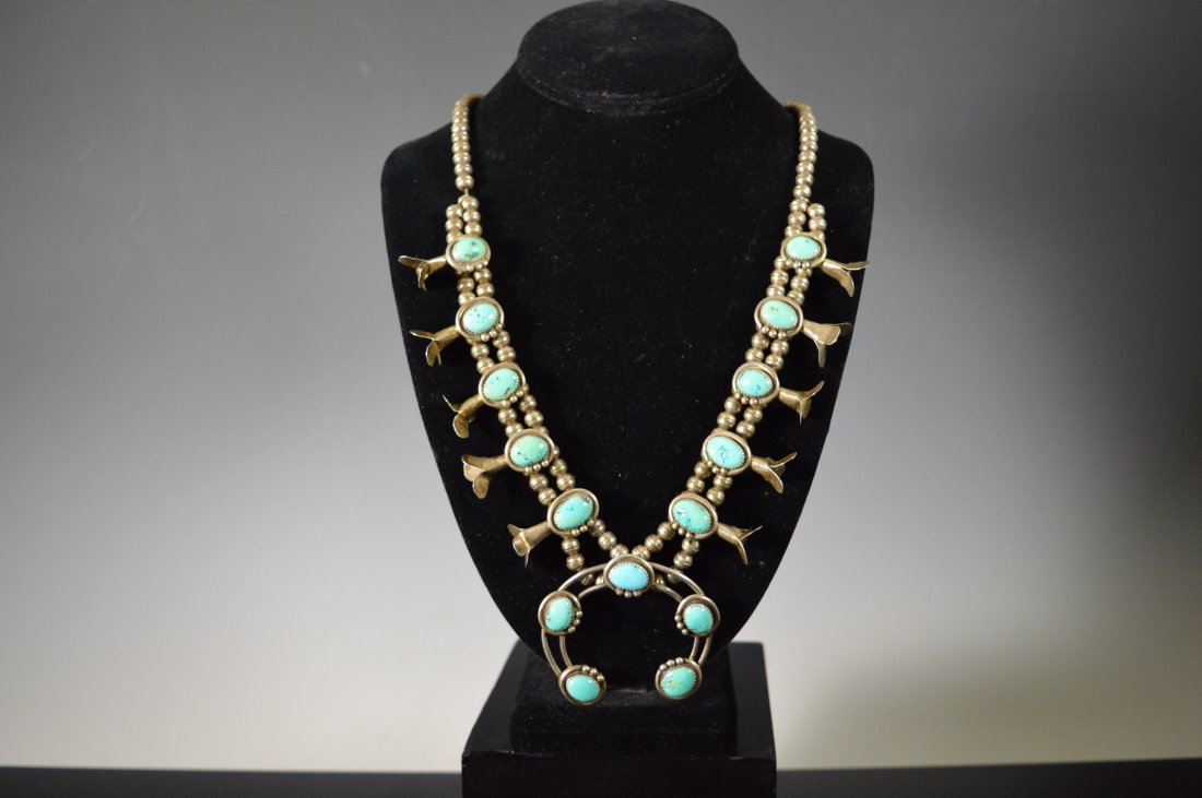 Navajo Squash Blossom Necklace, Silver and Turquoise: Navajo Squash Blossom Necklace, silver, with double silver wire Naja, 14 turquoise stones total. Attractive, dainty piece. FROM THE ESTATE OF JOHN KOEHLER. Mr. Koehler, an avid collector, had, at one 