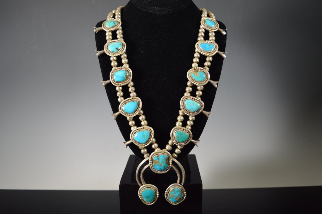 Navajo Squash Blossom Necklace, Silver and Turquoise: Navajo Squash Blossom silver necklace with double triangular silver wire Naja. 13 large turquoise stones, well matrixed. FROM THE ESTATE OF JOHN KOEHLER. Mr. Koehler, an avid collector, had, at one ti