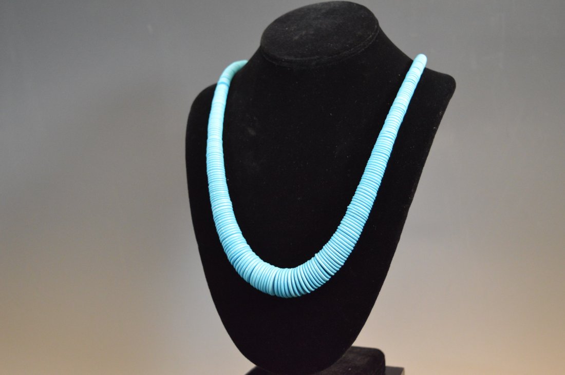 Santo Domingo Stabilized Turquoise Necklace: Necklace composed of graduated discoidal beads fashoined from stabilized or composite turquoise. FROM THE ESTATE OF JOHN KOEHLER. Mr. Koehler, an avid collector, had, at one time, purchased a defunct 