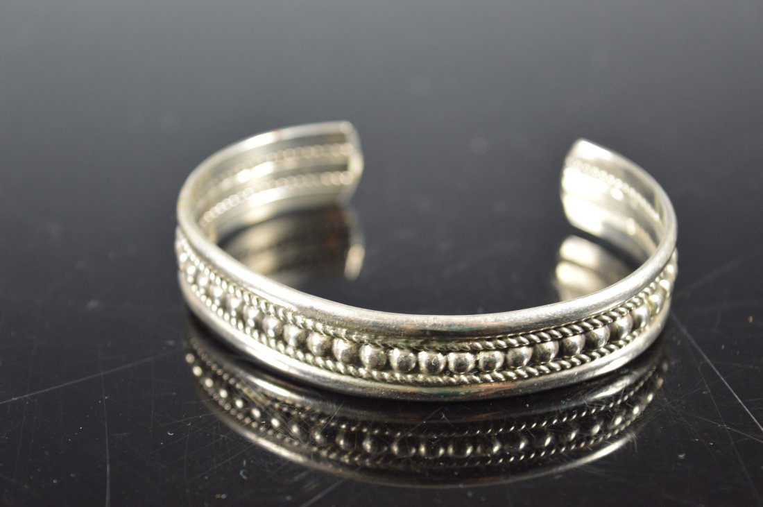 Silver Cuff Bracelet, Navajo: Delicate silver cuff bracelet, Navajo, triple band with twisted wire and silver beads. Stamped "Sterling." FROM THE ESTATE OF JOHN KOEHLER. Mr. Koehler, an avid collector, had, at one time, purchased 
