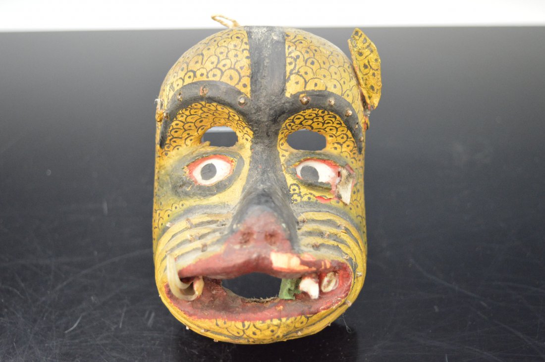 El Tigre Mexican Mini Mask: An antique Mexican mask of El Tigre, The Tiger. Carved from wood with leather attachments and real animal teeth. 5.0 inches long.