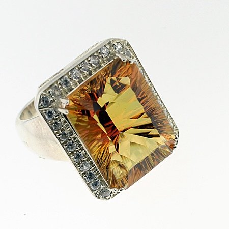 SILVER RING WITH MYSTIC QUARTZ AND WHITE ZIRCON: Stone : MYSTIC QUARTZ Metal : SILVER Cts: 20.00 Finish : POLISHED shape : REC Gmwt: 18.00 color :ORANGE size: 9 Stone: WHITE ZIRCON cts: 0.65