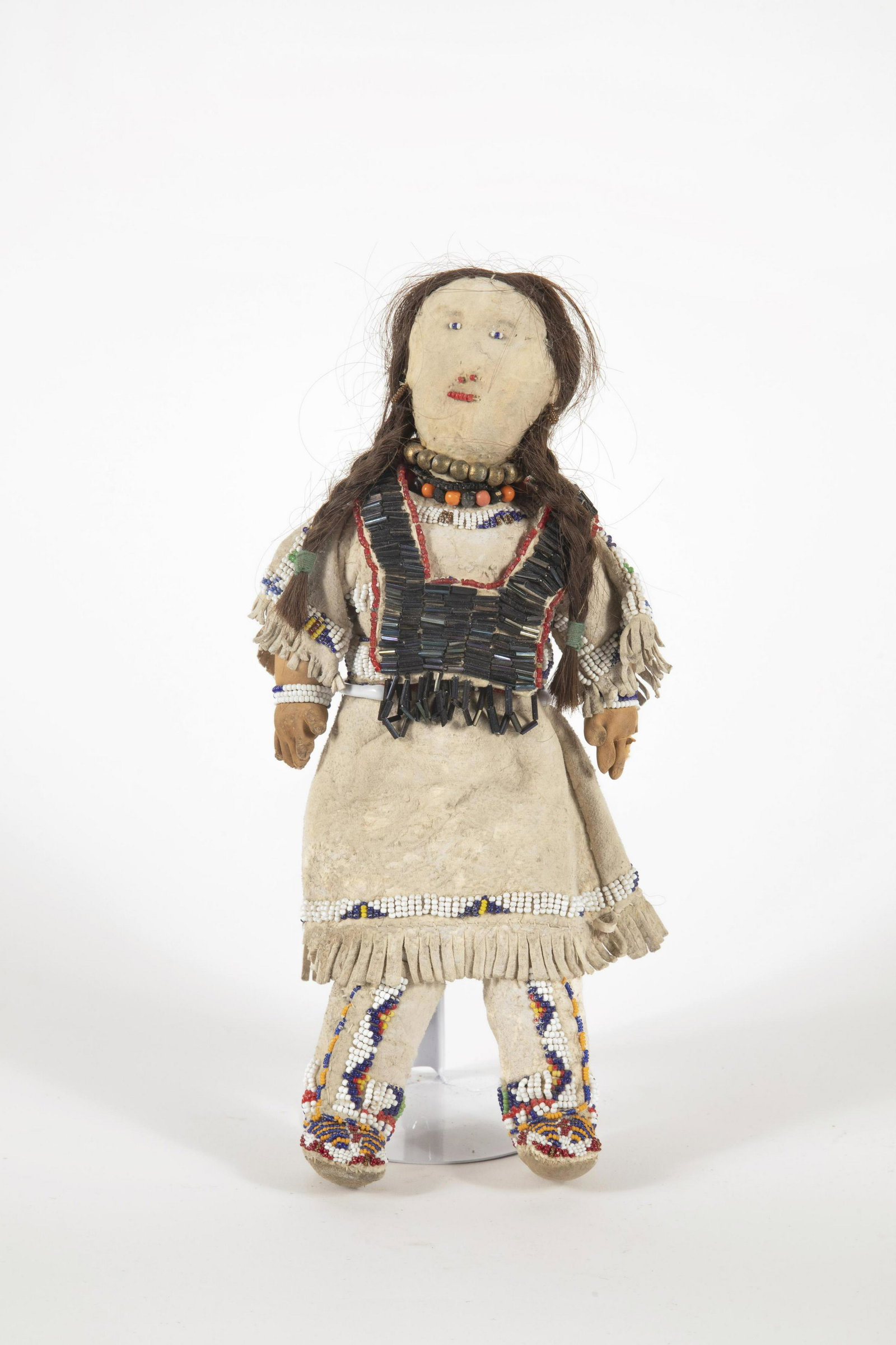 Oglala Sioux, Beaded Doll, ca. 1930: Oglala Sioux Beaded Doll, ca. 1930 Beaded Doll, ca. 1930 Pine Ridge, South Dakota. Legs and torso detached. Hide, glass beads, thread, cotton cloth, horse hair. 13 x 5 1/2 x 2 1/2 in. (33.02 x 13.97 x
