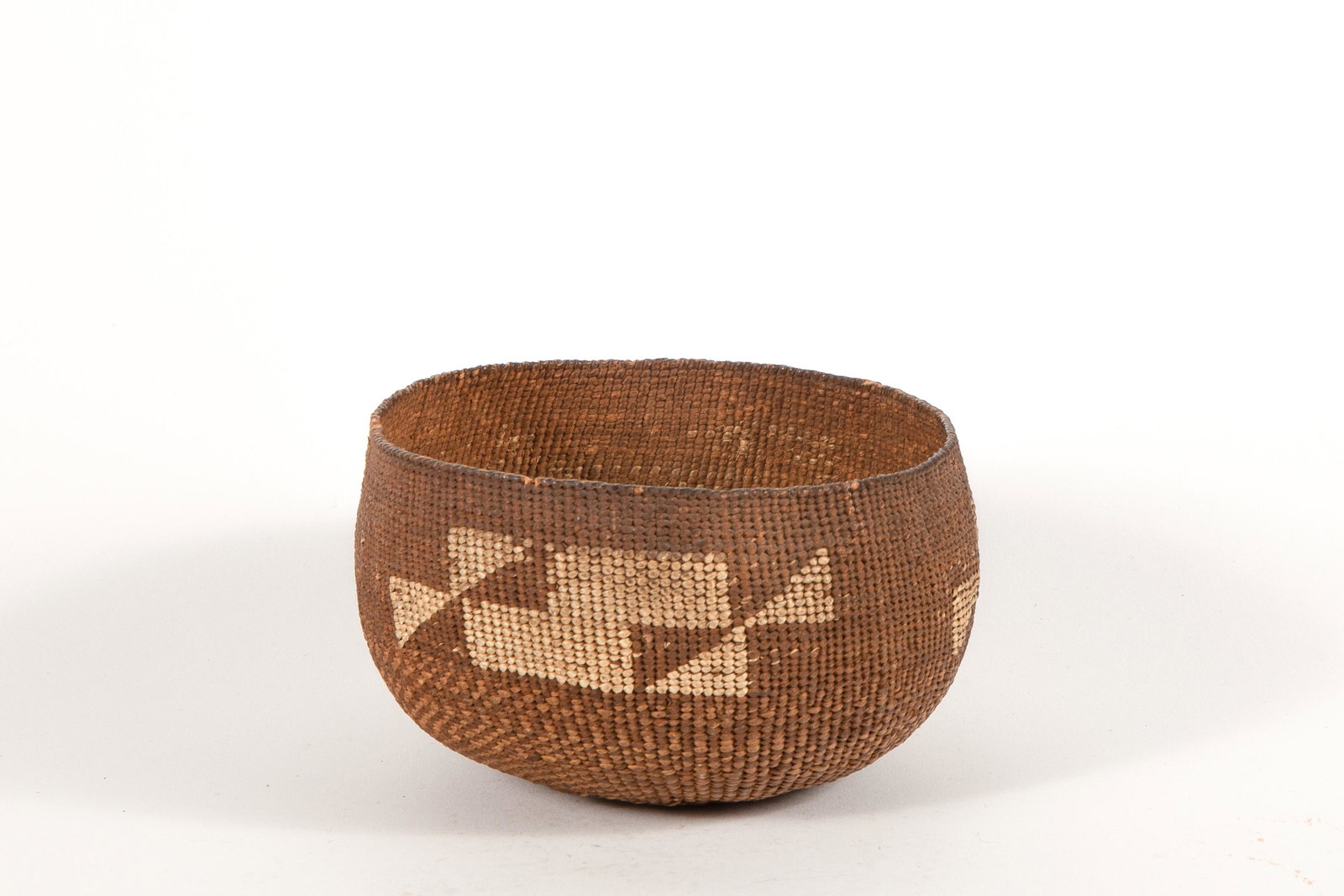 Karuk, Basketry Bowl, ca. 1900-1925: Karuk Basketry Bowl, ca. 1900-1925 Basketry Bowl, ca. 1900-1925 cedar bark, spruce root embellished with a band of geometric stepped and triangular design height 3 x diameter 5 5/8 in Provenance: Pr