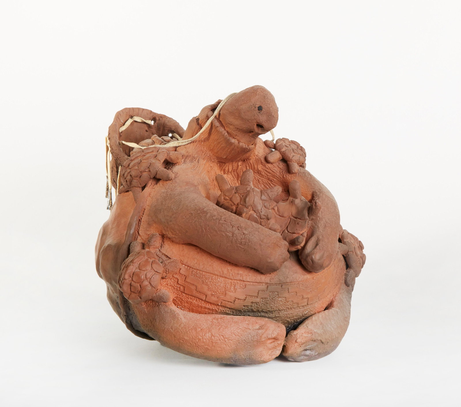 Choctaw, Randy Chitto, Anumpa Nan Anoli (Apache: Randy Chitto (Choctaw, b. 1962) Anumpa Nan Anoli (Apache Storyteller Turtle), 1983 fired clay, leather, tin inscribed: CHitto 10 x 11 x 10 1/2 in. (25.40 x 27.94 x 26.67 cm.) Provenance: The Barb