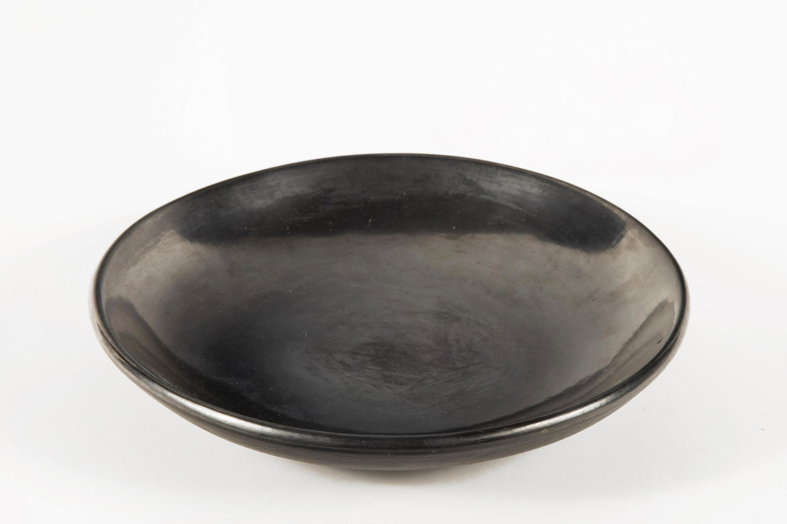 San Ildefonso, Maria Martinez, Blackware Bowl: Maria Martinez(San Ildefonso, 1887 - 1980)Blackware Bowlinscribed: Maria / Povekaheight 2 1/4 x diameter 11 1/2