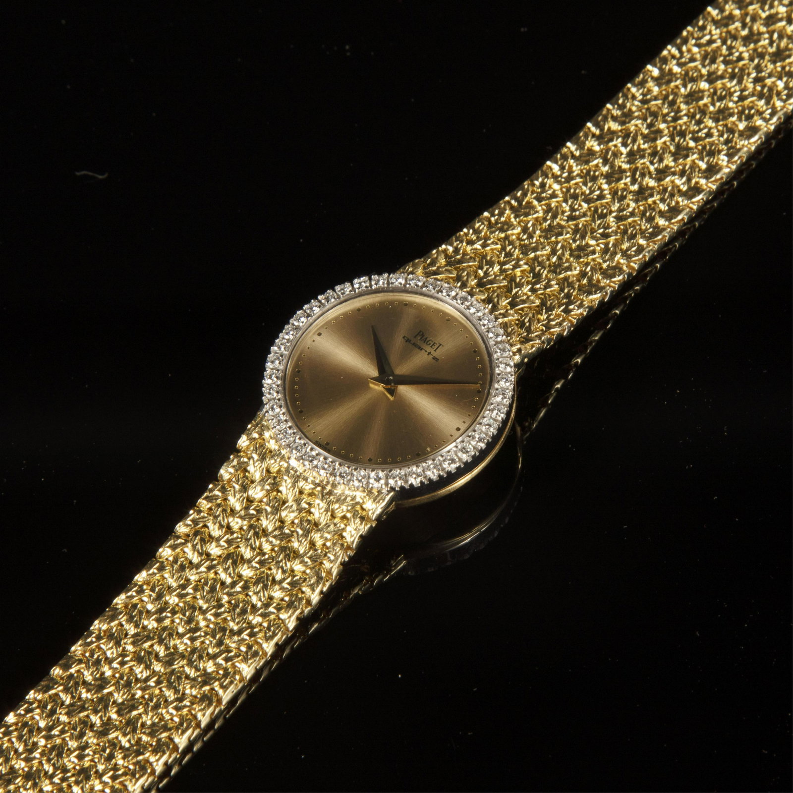 Piaget, Ref. 726 D 2 Bracelet Watch: Piaget A Yellow Gold and Diamond Bracelet Watch Ref. 726 D 2 Circa 1975 Case: 18k yellow gold, snap on case back, No. 338008 Dial: gilt metal Movement: quartz Case, dial and movement signed Accompanie