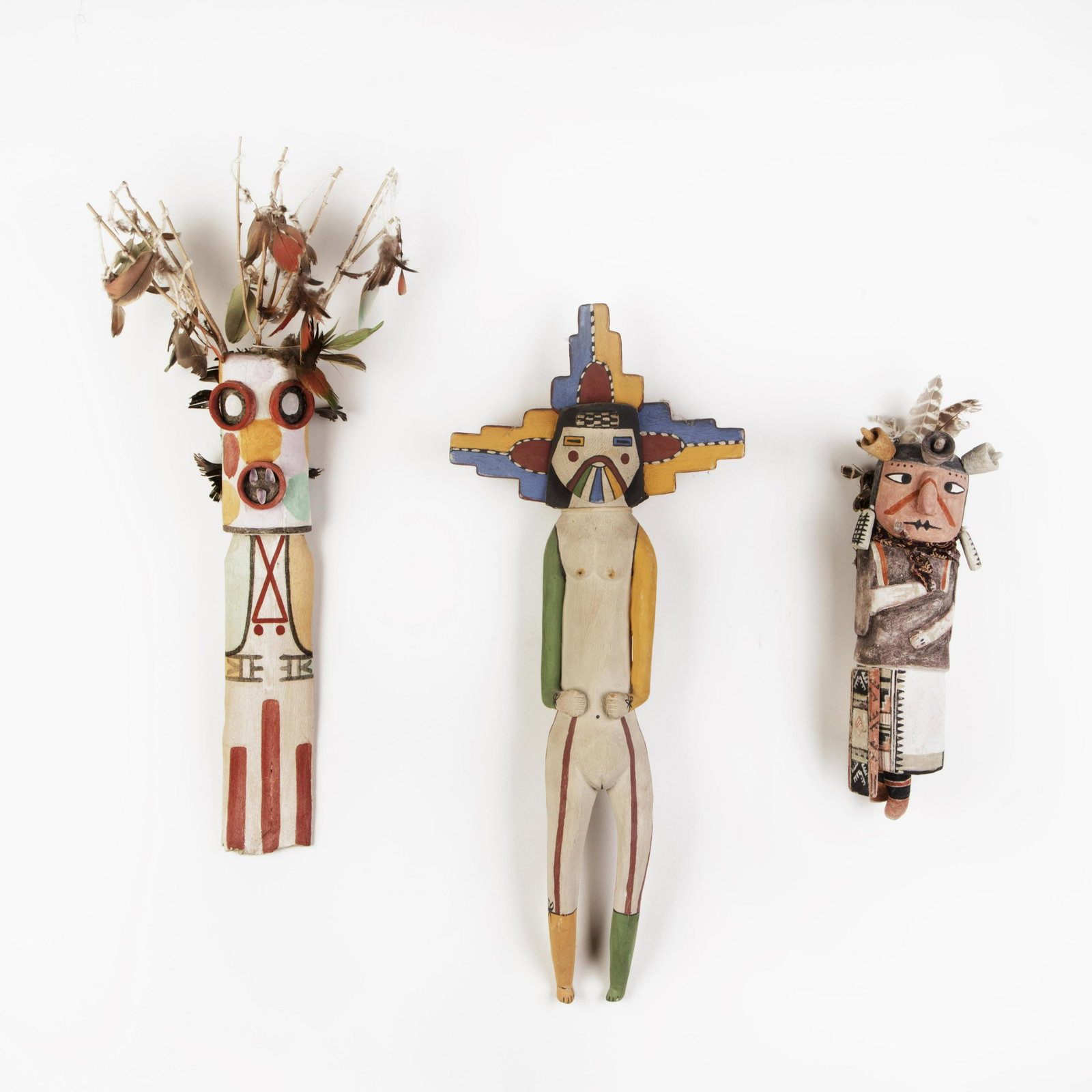 A Group of Three Hopi Kachinas, 20th Century: Hopi Group of Three Kachinas, 20th Century Kachina23 x 9 1/2 x 2 1/4 in. (58.42 x 24.13 x 5.72 cm.) Sa’lakwmana Kachina 23 x 9 1/2 x 2 3/4 in. (58.42 x 24.13 x 6.99 cm.) Randy