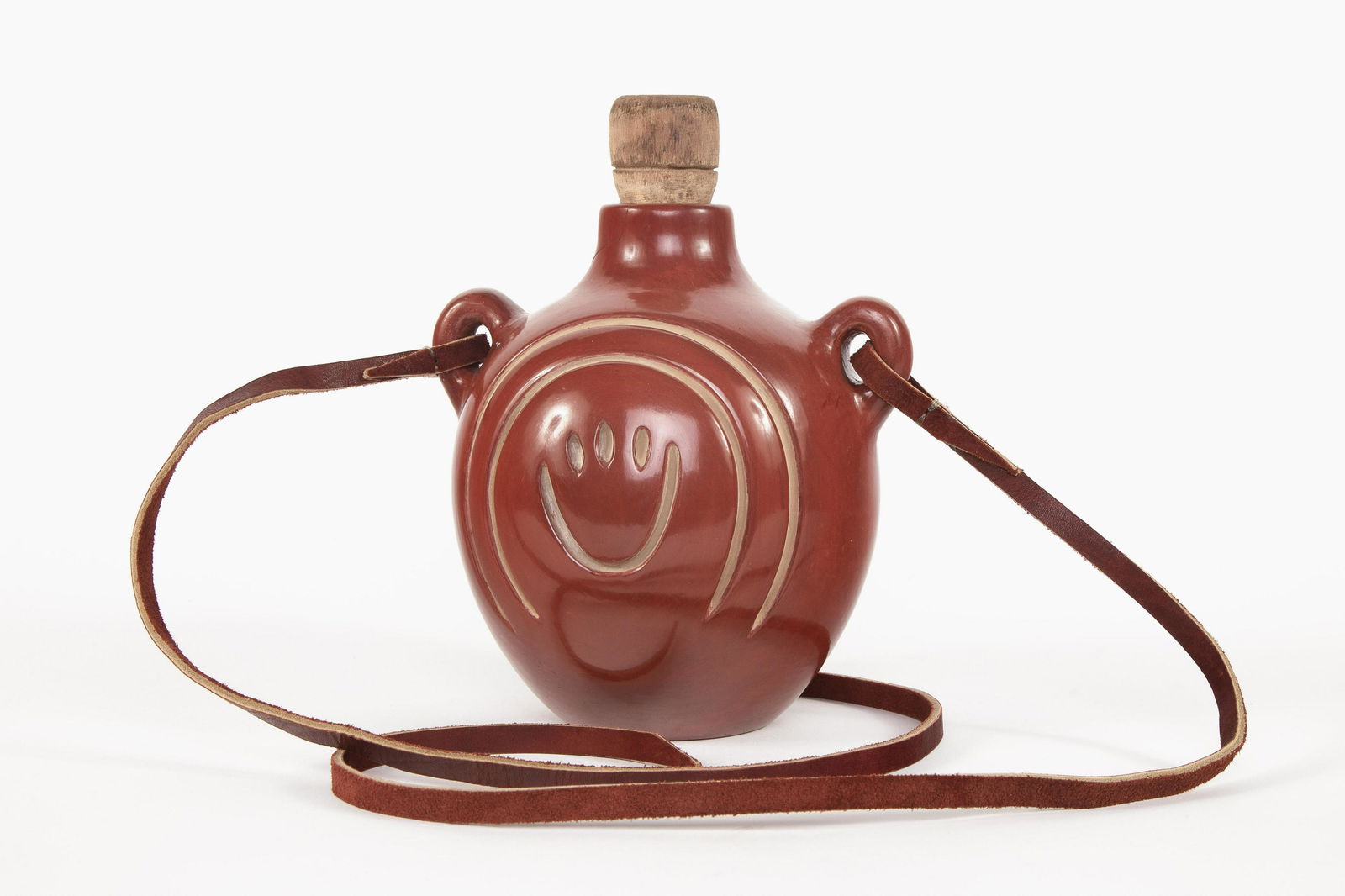 Santa Clara, Jennie Trammel, Redware Water Jar: Jennie Trammel(Santa Clara, 1929 - 2010)Redware Water Jar with Bear Claw and Avanyu Designsfired clay, red slipcoil-built, having deeply carved design elements representing a bear claw and the Avanyu