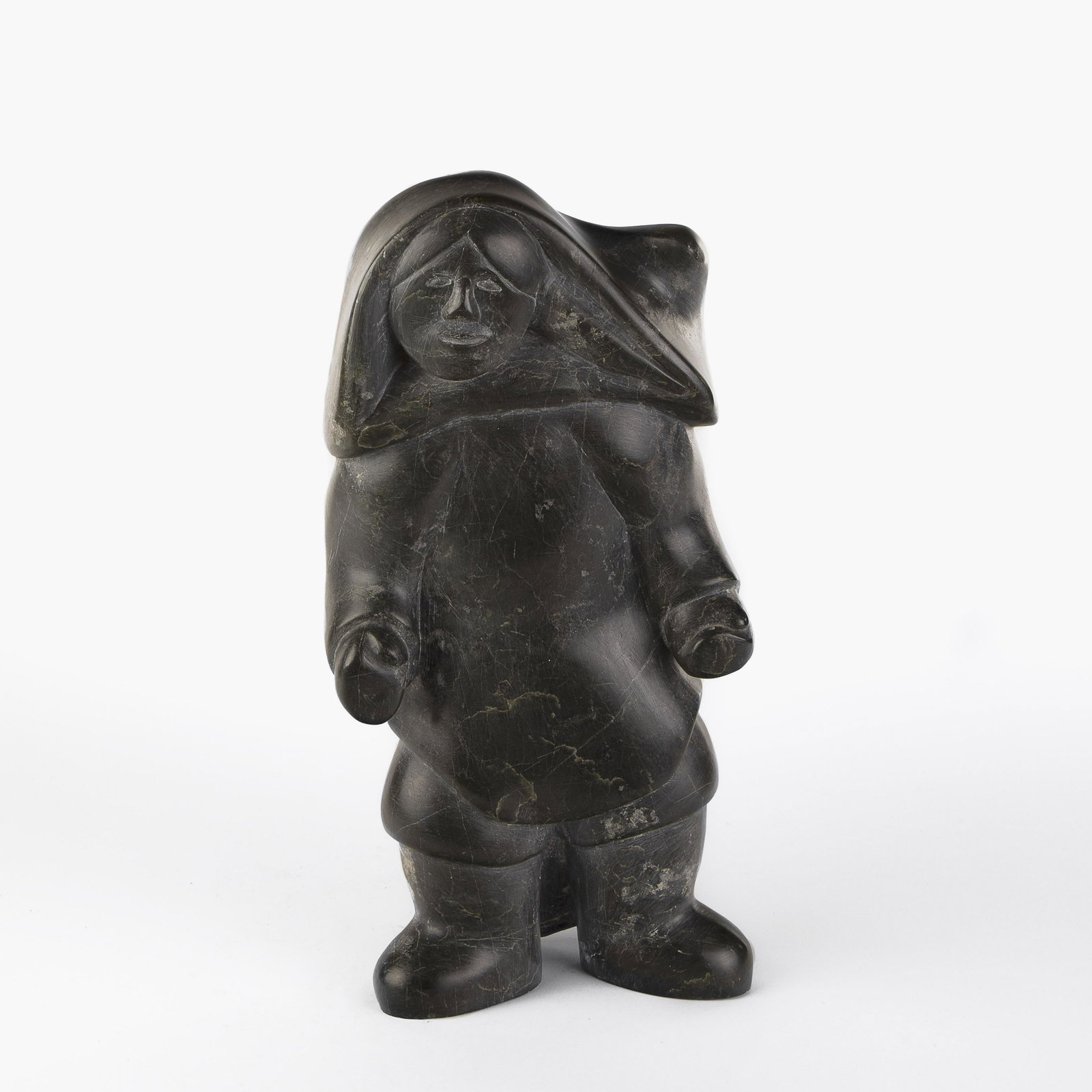 Inuit, Kaka Ashoona [Qaqaq], Carved Cape Dorset Figure: Kaka Ashoona [Qaqaq] (Inuit/Canadian, 1928 - 1996) Carved Cape Dorset Figure carved soapstone inscribed underside: KAKA 17 x 8 1/2 x 4 1/2 in. (43.18 x 21.59 x 11.43 cm.) **Proceeds from the sale of t