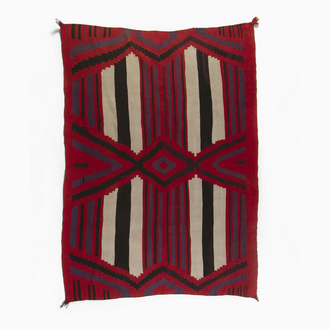 A Navajo Germantown Third Phase Chief: Diné [Navajo] Germantown Third Phase Chief's Blanket, ca. 1890 plied wool, aniline dye Woven with commercially plied wool Germantown yarns. 68 x 51 1/2 in. (172.72 x 130.81 cm.) Private Collection, N