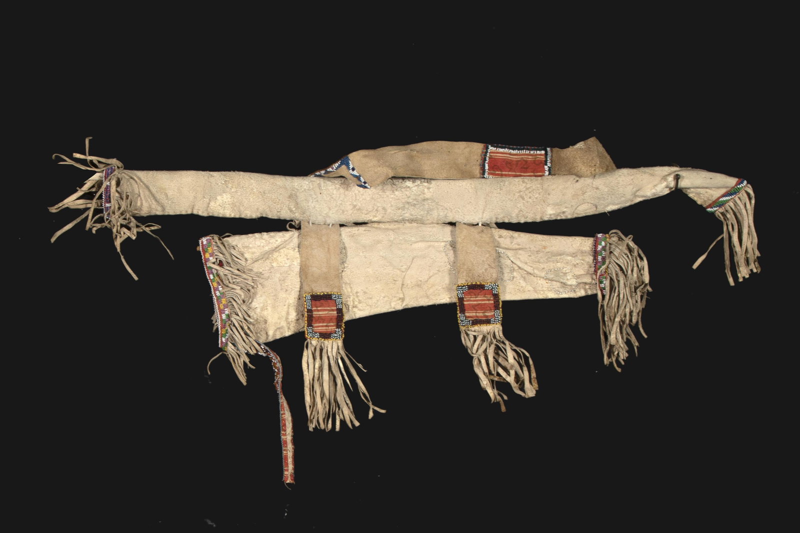 A Possibly Jicarilla Apache Child's Beaded Hide Quiver,: Possibly Jicarilla Apache Child's Beaded Hide Quiver, ca. 1900-1920 having white, yellow, yellow-orange, green, dark purple, light purple, green, light blue, navy blue glass seed beads 24 x 36 in. (60