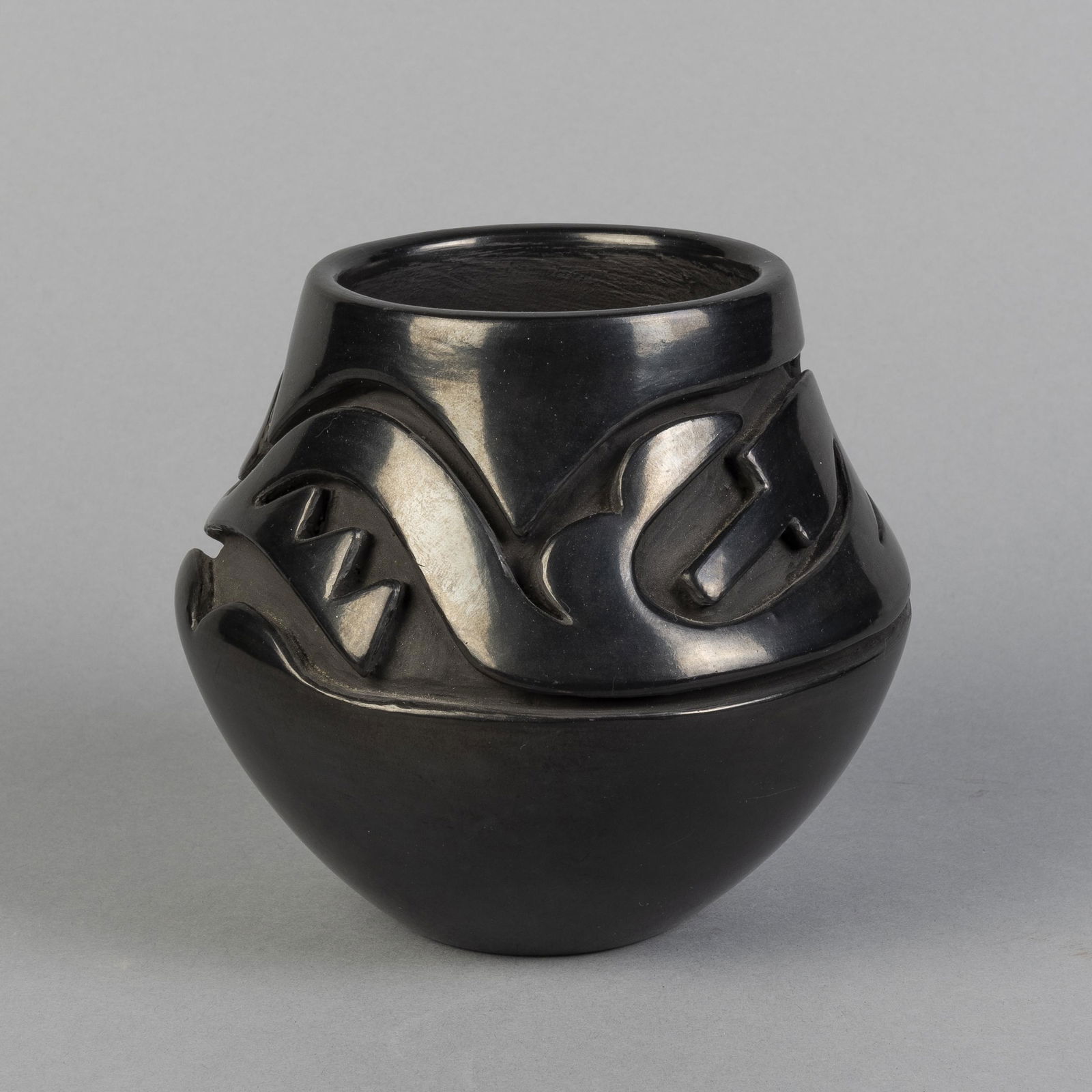 Santa Clara, Teresita Naranjo, Small Carved Blackware: Teresita Naranjo(Santa Clara, 1919 - 1999)Small Carved Blackware Jarfired clayinscribed underside: Teresita / Naranjo / Santa Clara / Puebloheight 5 1/4 x diameter 5 1/2 in. (13.34 x 13.97 cm.) Privat