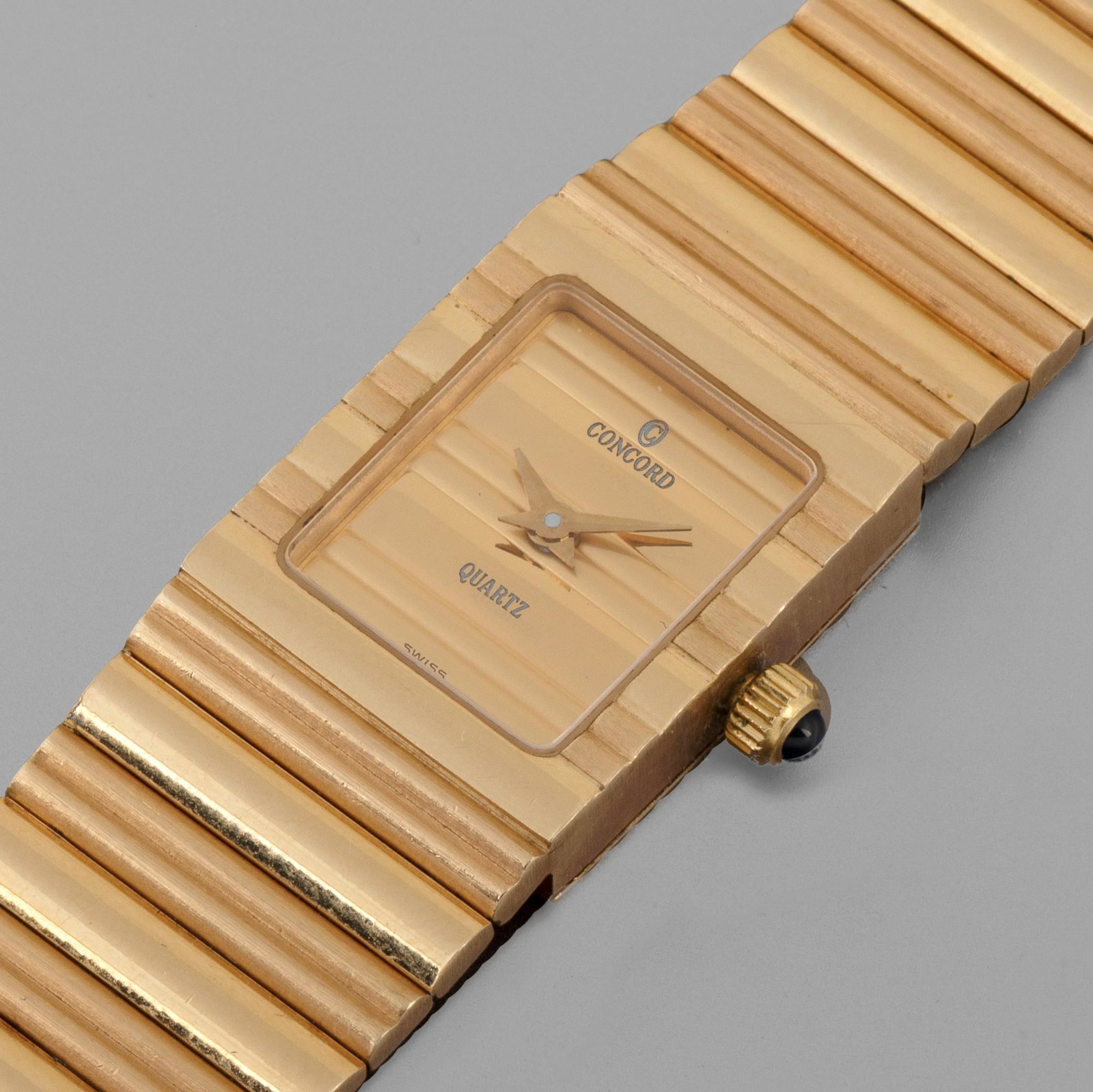 Concord, Yellow Gold Ref. 20-81-828C411 Bracelet Watch,: Concord A Yellow Gold Bracelet Watch Ref. 20-81-828C411 Circa 1980 Case: 14k yellow gold Dial: Mirrored and brushed yellow gold M'vmt: Quartz Case, dial and movement signed With an integrated 14k Conc
