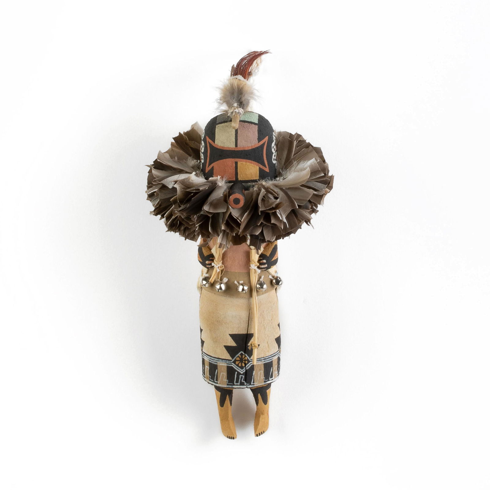 Randy Brokeshoulder, Sipkini (Zuni Warrior) Katsina: Randy Brokeshoulder(Hopi, b. 1983)Sipkini (Zuni Warrior) Katsinacarved cottonwood, pigments, feathers, corn husk, bellsinscribed underside: [artist's cipher] / RB13 x 6 3/4 x 5 3/8 in. (33.02 x 17.15