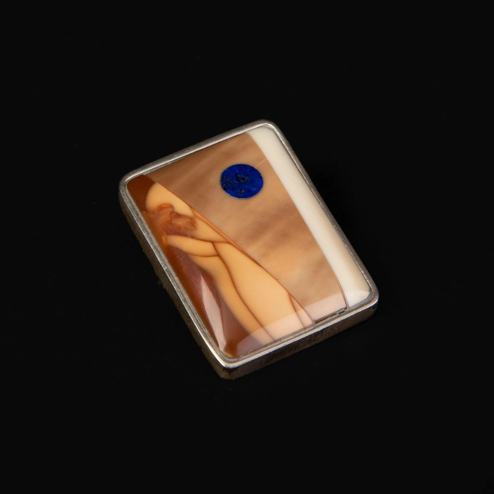 David Wallace, Silver and Fossilized Ivory Pictorial Pin, 2008: David Wallace(Chugach Sugpiaq, 20th Century)Silver and Fossilized Ivory Pictorial Pin, 2008silver, fossilized ivoryinscribed verso: STERLING / FOSSIL IVORY / 2008 / David Wallaceoverall weight: 0.5 oz