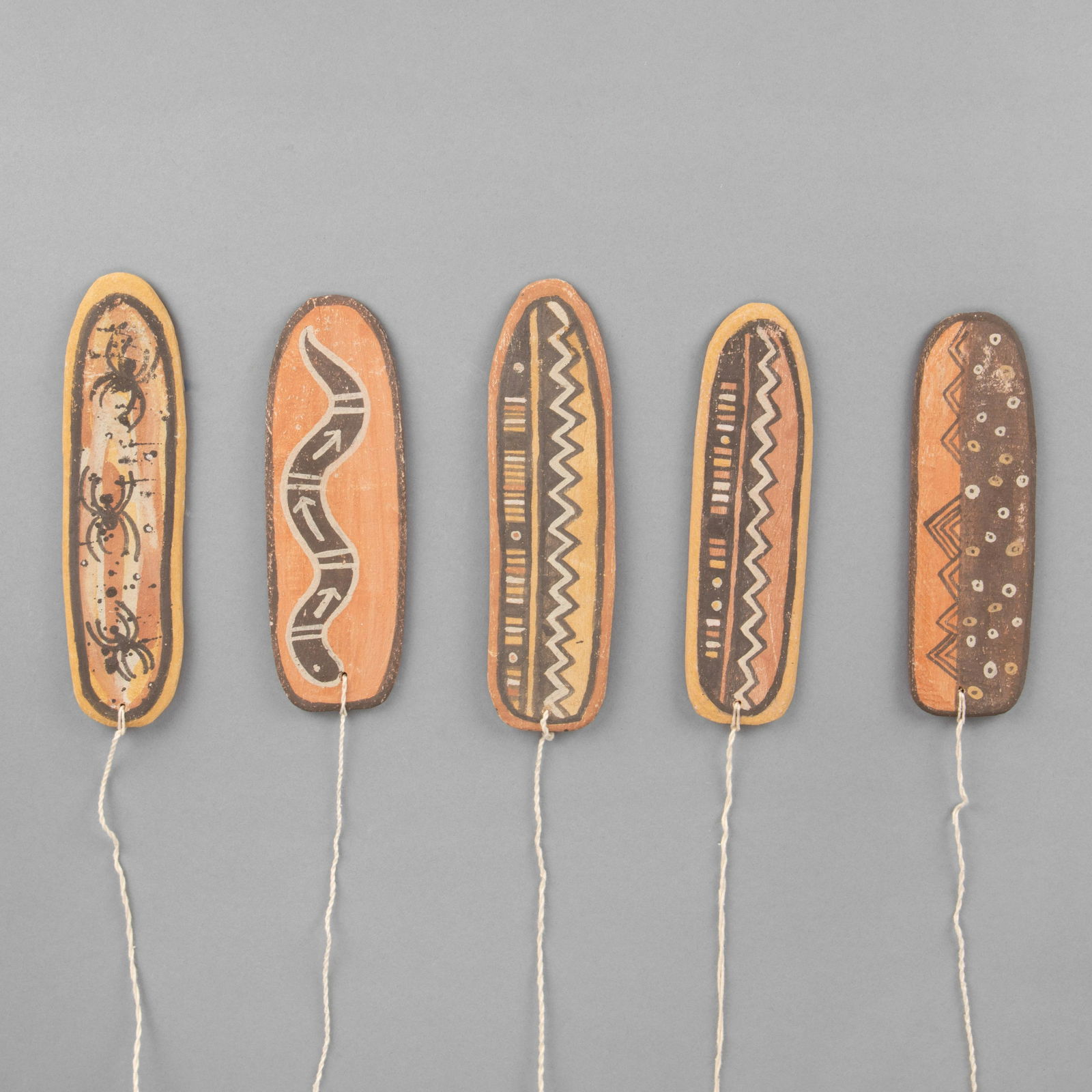 Hopi, Sheryl Susunkewa, Group of Five Painted Cottonwood Bull Roarers: Sheryl Susunkewa(Hopi, 20th Century)Group of Five Painted Cottonwood Bull Roarersnatural earth pigments, cotton woodeach inscribed: S. SusunkewaLargest: 8 x 2 1/8 x 0 1/4 in. (20.32 x 5.40 x 0.64 cm.)