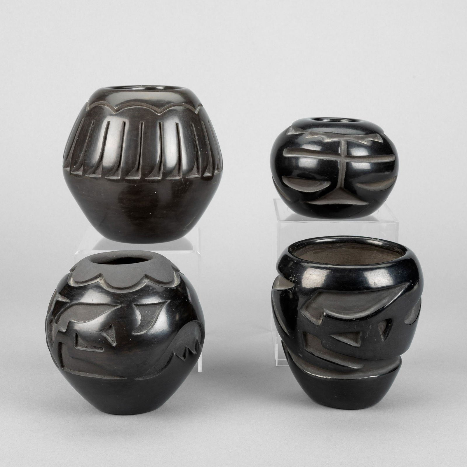 Santa Clara, Group of Four Carved Blackware Jars (1 of 3)