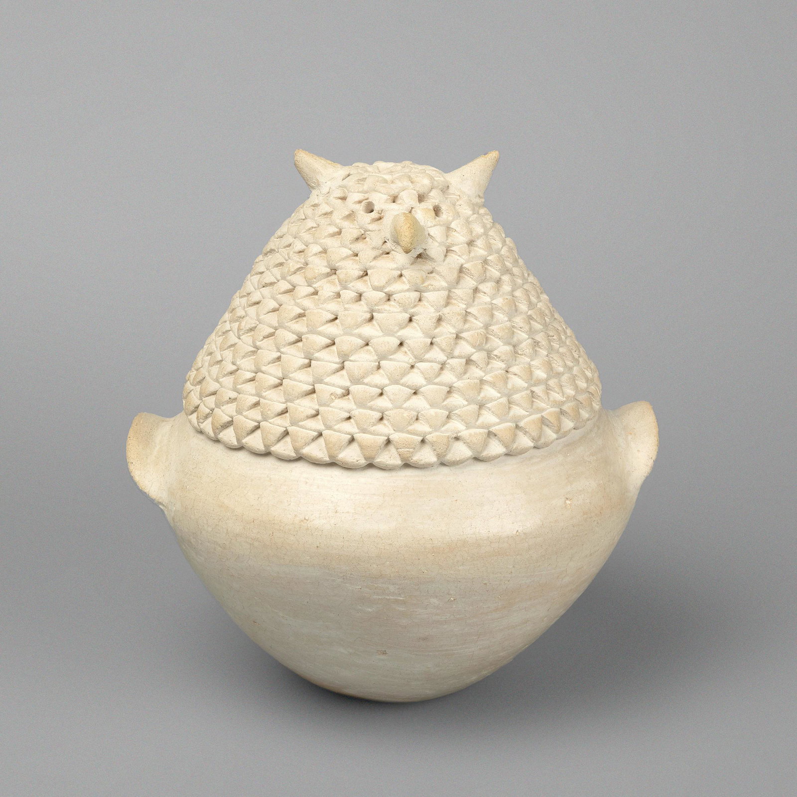 Acoma, Stella Shutiva, Corrugated Whiteware Owl, ca. 1980s: Stella Shutiva (Acoma, 1939 - 1997) Corrugated Whiteware Owl, ca. 1980s fired clay inscribed: S. Shutiva / Acoma, N Mex. Height 7 5/8 x Diameter 7 1/2 in. (19.37 x 19.05 cm.) Private Collection, Oklah