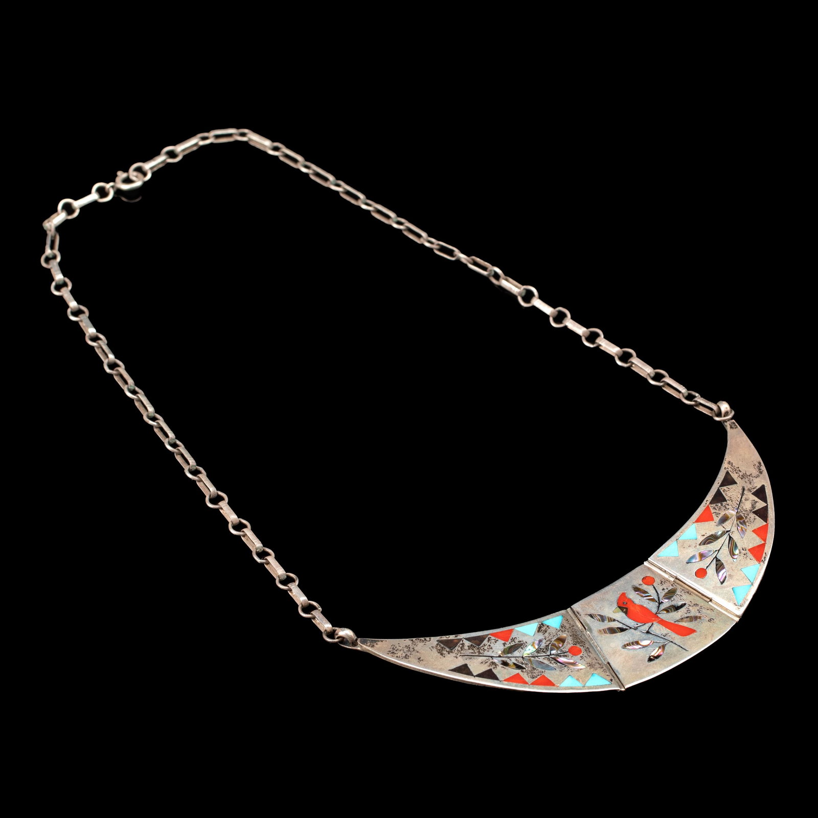 Derrick and Nichelle Edaakie, Silver and Stone Inlay Choker Necklace: Derrick + Nichelle Edaakie (Zuni, 20th Century) Silver and Stone Inlay Choker Necklace silver, stone marked: Derrick + Nichelle / Edaakie overall weight: 40 grams 2 1/8 x 4 3/4 in. (5.40 x 12.07 cm.),