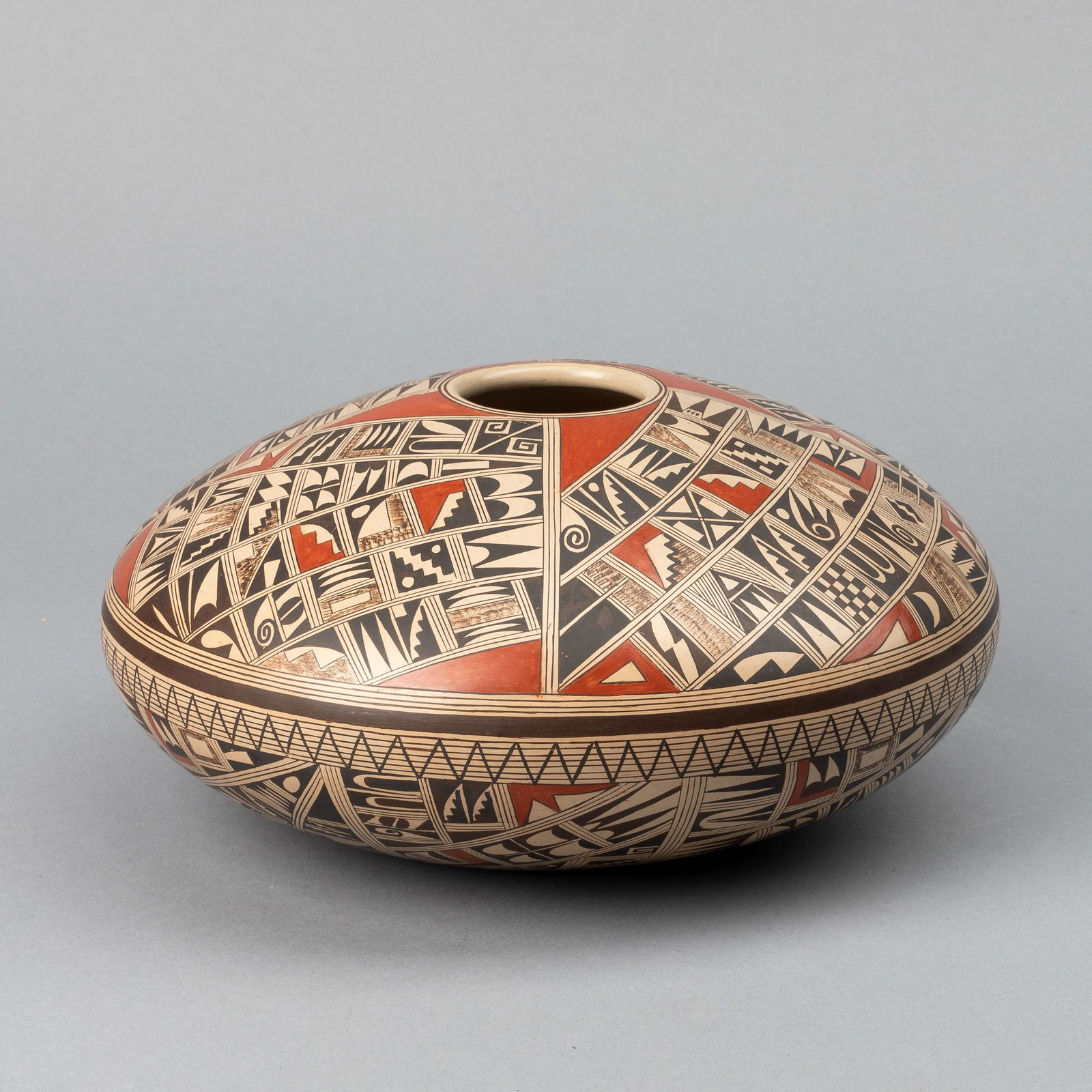 Hopi-Tewa, Rondina Huma, Large Polychrome Seed Pot: Rondina Huma(Tewa/Hopi, b. 1947)Large Polychrome Seed Potfired clay, pigmentsinscribed underside: RONDINA HUMA / TEWA / POLACCA, AZ.Height: 4 3/4 x Diameter: 10 in. (12.1 x 25.4 cm.)