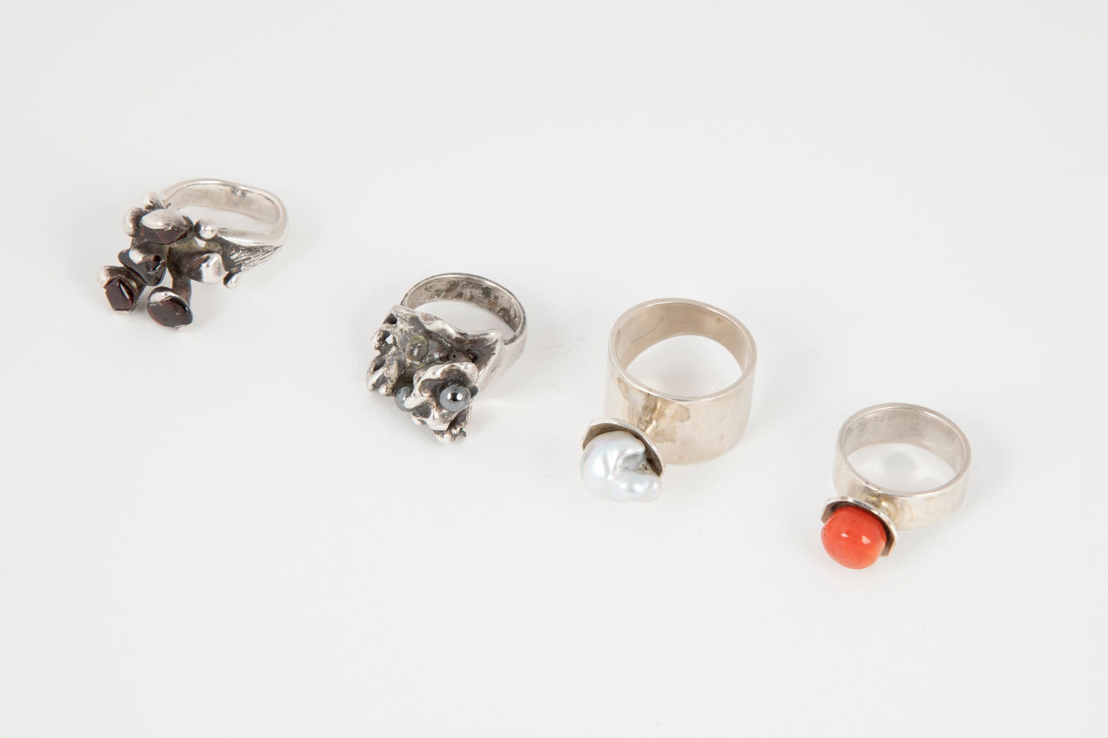 Attributed to Charles Loloma, Hopi, Set of 4 Silver and Semi-Precious Stone Rings (1 of 1)