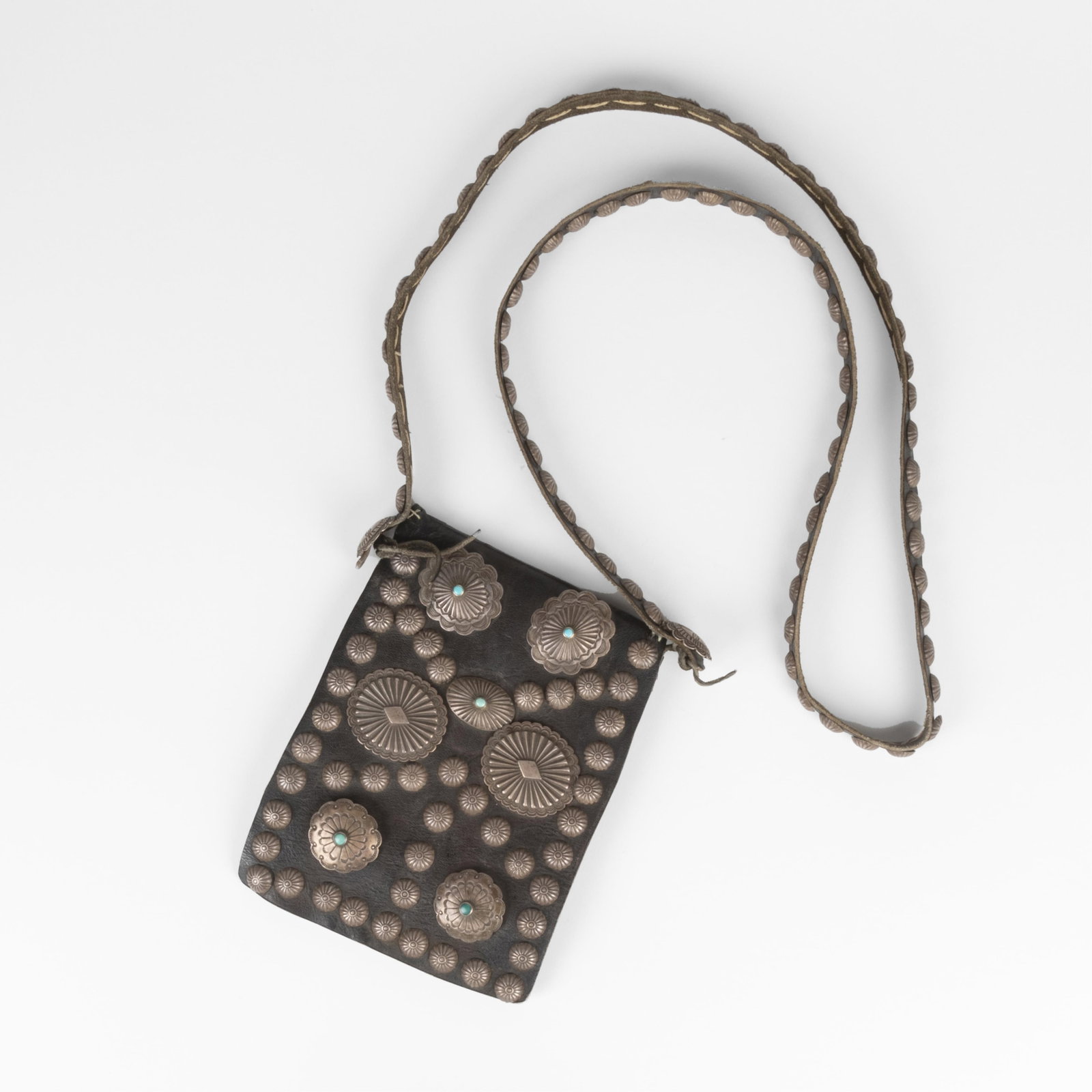 Shoulder Bag with Silver and Turquoise Conchos: Shoulder Bag with Silver and Turquoise Conchos commercial leather, turquoise, sterling silver features authentic Diné (Navajo) conchos and silver buttons, circa 1930. strap length: 24 in. (61 cm.), b