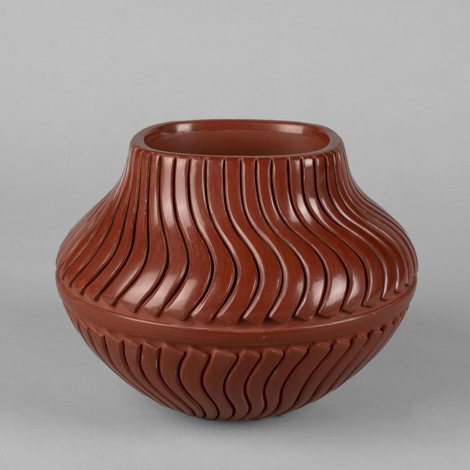 Linda Tafoya-Sanchez, Carved Redware Melon Swirl Jar, ca. 1990: Linda Tafoya-Sanchez(Santa Clara/Ohkay Owingeh [San Juan], b. 1962)Carved Redware Melon Swirl Jar, ca. 1990fired clayinscribed: LINDA / TAFOYA-SANCHEZ / SANTA CLARA / PUEBLO5 1/2 x 7 1/8 in. (14 x 18.