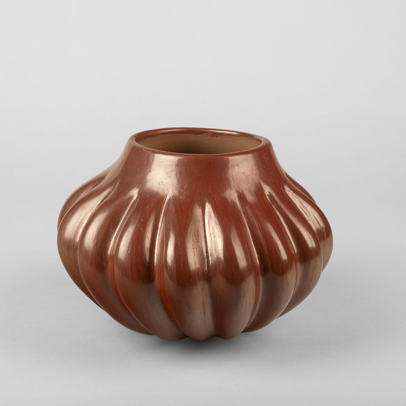 Helen Shupla, Redware Melon Jar, ca. 1985: Helen Shupla(Santa Clara, 1918-1985)Redware Melon Jar, ca. 1985fired clayinscribed: Helen Shupla / Santa Clara / Pueblo6 3/8 x 8 3/4 in. (16.2 x 22.2 cm.) Private Collection, Colorado