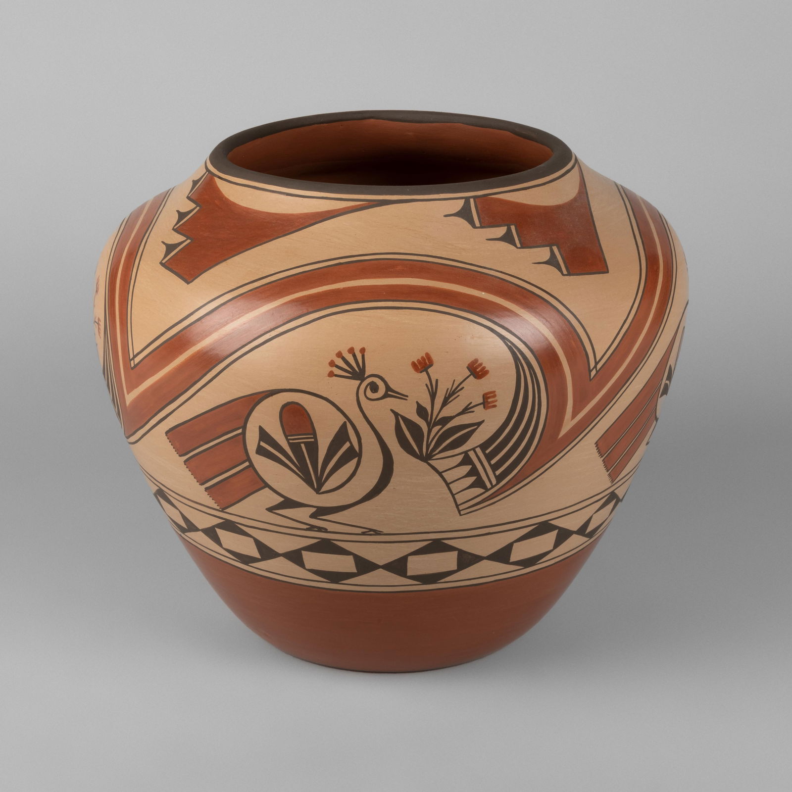 Eleanor Griego, Polychrome Redware Jar with Zia Bird, ca. 1975: Eleanor Griego(Zia, b. 1953)Polychrome Redware Jar with Zia Bird, ca. 1975fired clay, pigmentsSigned bottom: ELEANOR / PINO / GRIEGO / ZIA10 1/2 x 12 in. (26.7 x 30.5 cm.) Private Collection, New Mexi