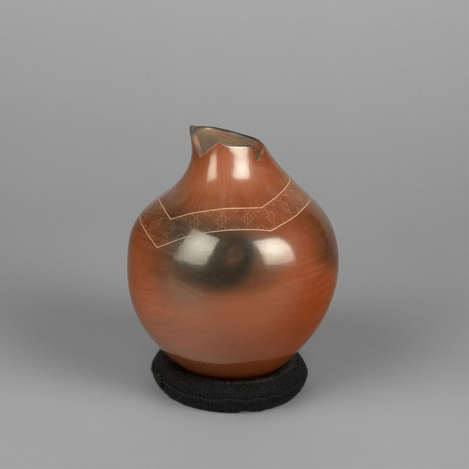 Polly Rose, Polished Redware Jar with Fire Clouds, ca. 2000: Polly RoseSanta Clara, (b. 1962)Polished Redware Jar with Fire Clouds, ca. 2000fired clayinscribed: Polly Roseheight: 5.6 in. (14.4 cm.), diameter: 4 1/2 in. (11.4 cm.) The Larry Martine Collection, S