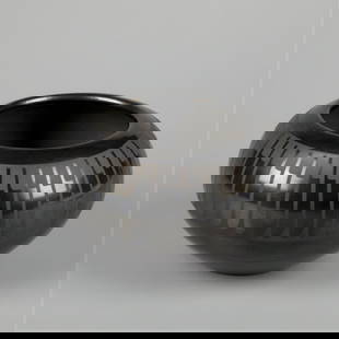 Maria Martinez + Popovi Da, Feather Blackware Pot: Maria Martinez + Popovi DaSan Ildefonso, (1887 - 1980) + (1920 - 1971)Feather Blackware Pot, ca. 1960fired clayinscribed: Maria / Popovi / 1624 1/8 x 6 7/8 in. (10.5 x 17.5 cm.) Private Collection, Co