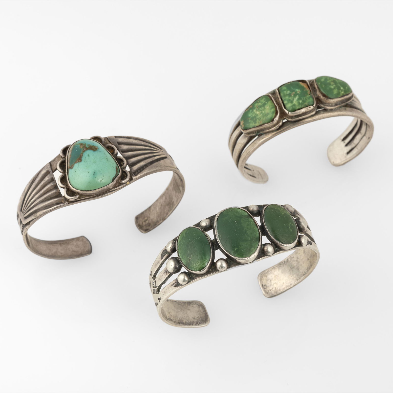 Three Green Turquoise Cuff Bracelets: Three Green Turquoise Cuff Braceletssilver, turquoisetop left: internal circumference: 6 in. (15.2 cm.), width: 2 1/4 in. (5.7 cm.), gap: 3/4 in. (1.9 cm.); center: internal circumference: 6 1/4 in. (