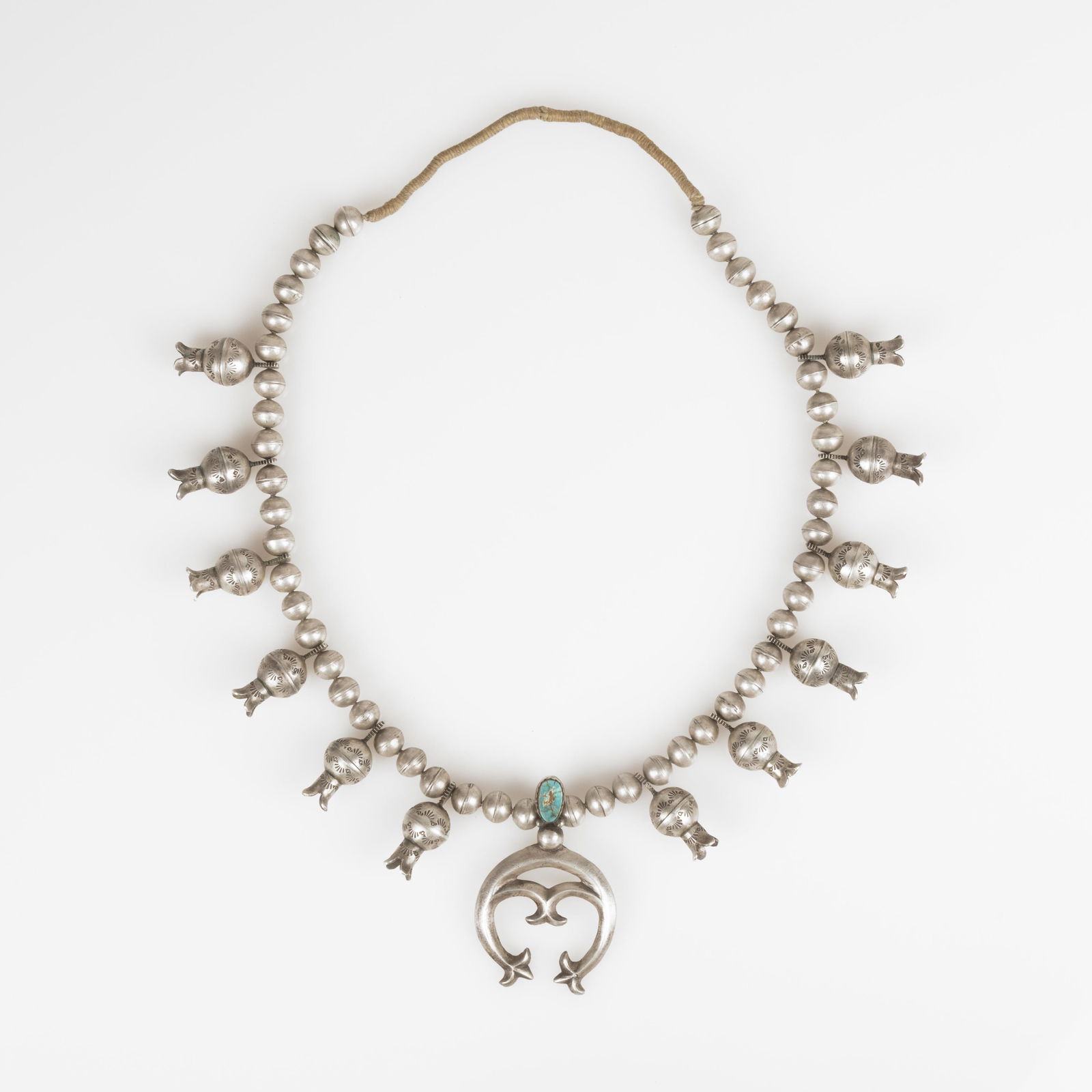 Diné (Navajo), Squash Blossom Necklace with Grandmother Wrap, ca. 1950 (1 of 3)