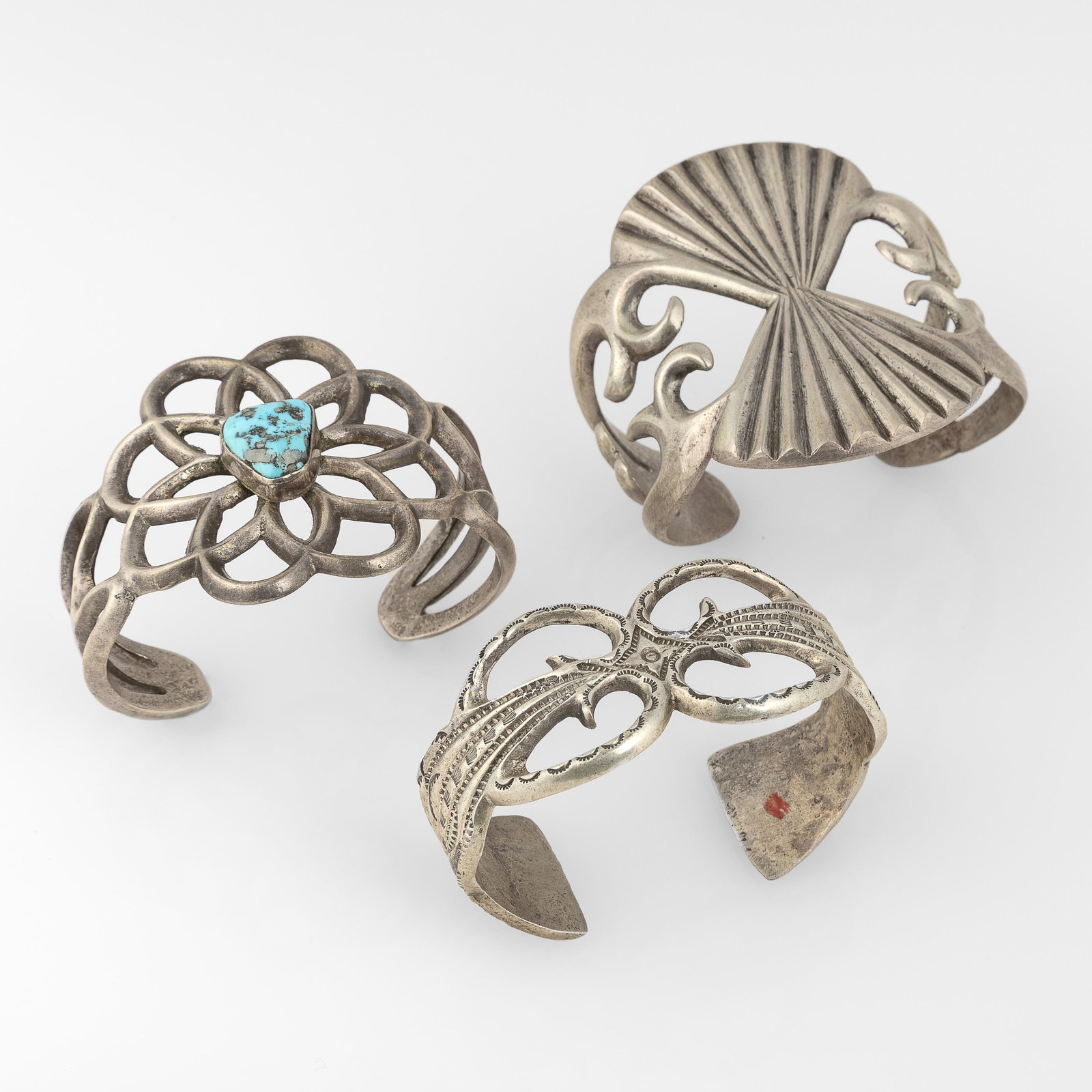 Attributed Diné (Navajo), Three Sandcast Cuff Bracelets, ca. 1950 - 1960 (1 of 3)