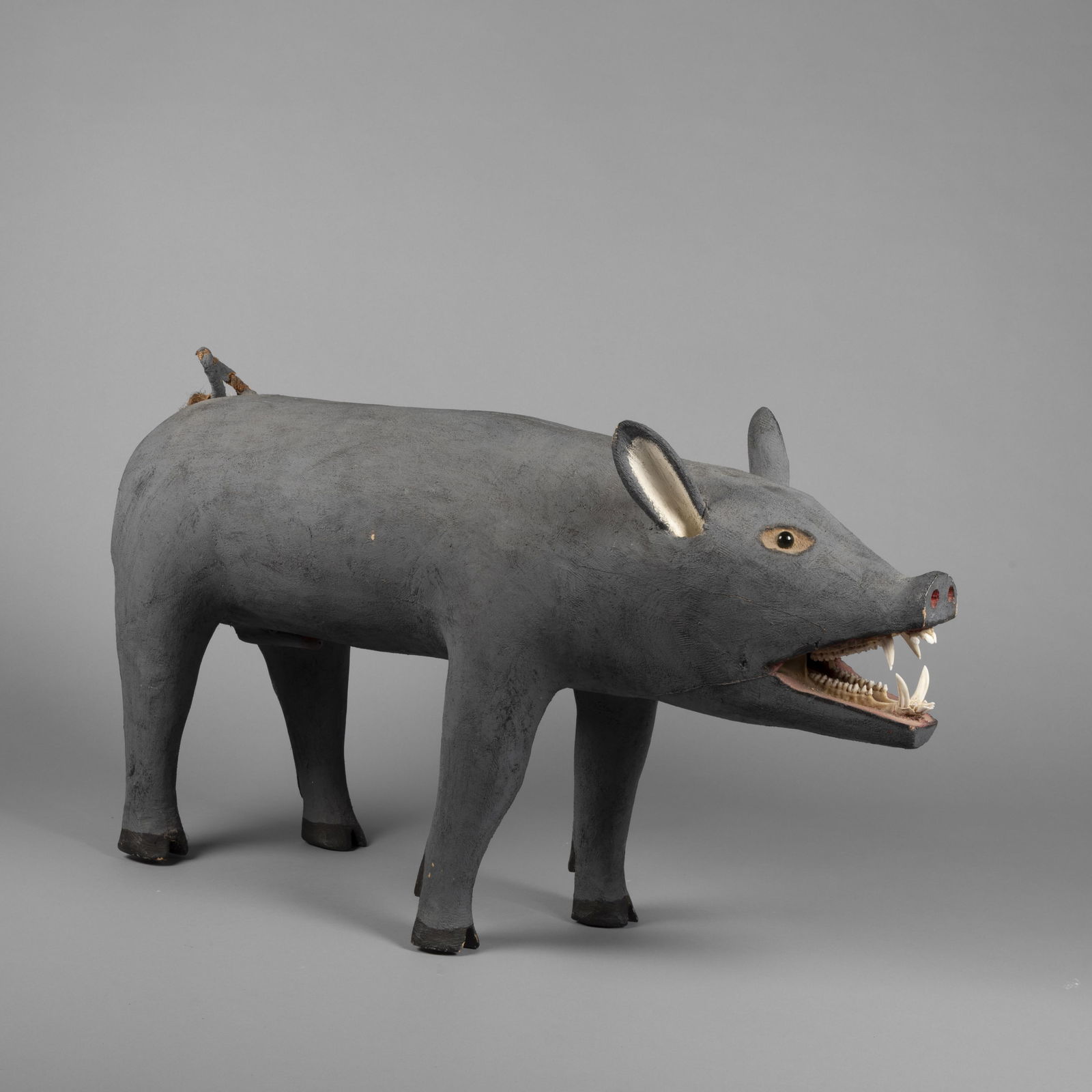 Leroy Archuleta, Folk Art Pig, 1987: Leroy Archuleta1949 - 2002Folk Art Pig, 1987carved and painted wood, glass, fibers, pig jaw and teethinscribed: 2-3-87 / Leroy ArchulEtA23 x 42 x 10 in. (58.4 x 106.7 x 25.4 cm.) Private Collect