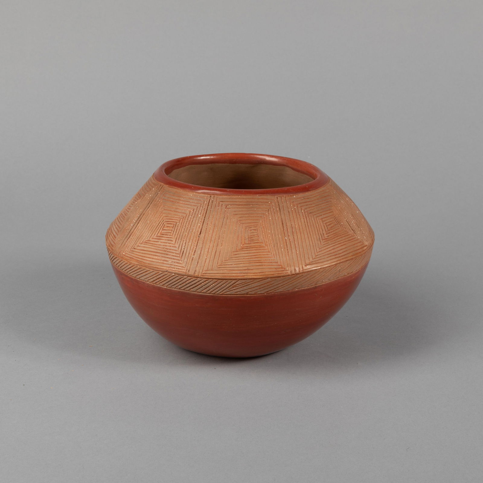 Dominguita Sisneros + Tomasita Montoya, Sgraffito Redware Pot with Geometric Designs, ca. 1975: Dominguita Sisneros + Tomasita MontoyaOhkay Owingeh (San Juan), b. 1942 + 1899 - 1978Sgraffito Redware Pot with Geometric Designs, ca. 1975fired clayinscribed: Tomasita / Montoya / Dominguita / Sisner