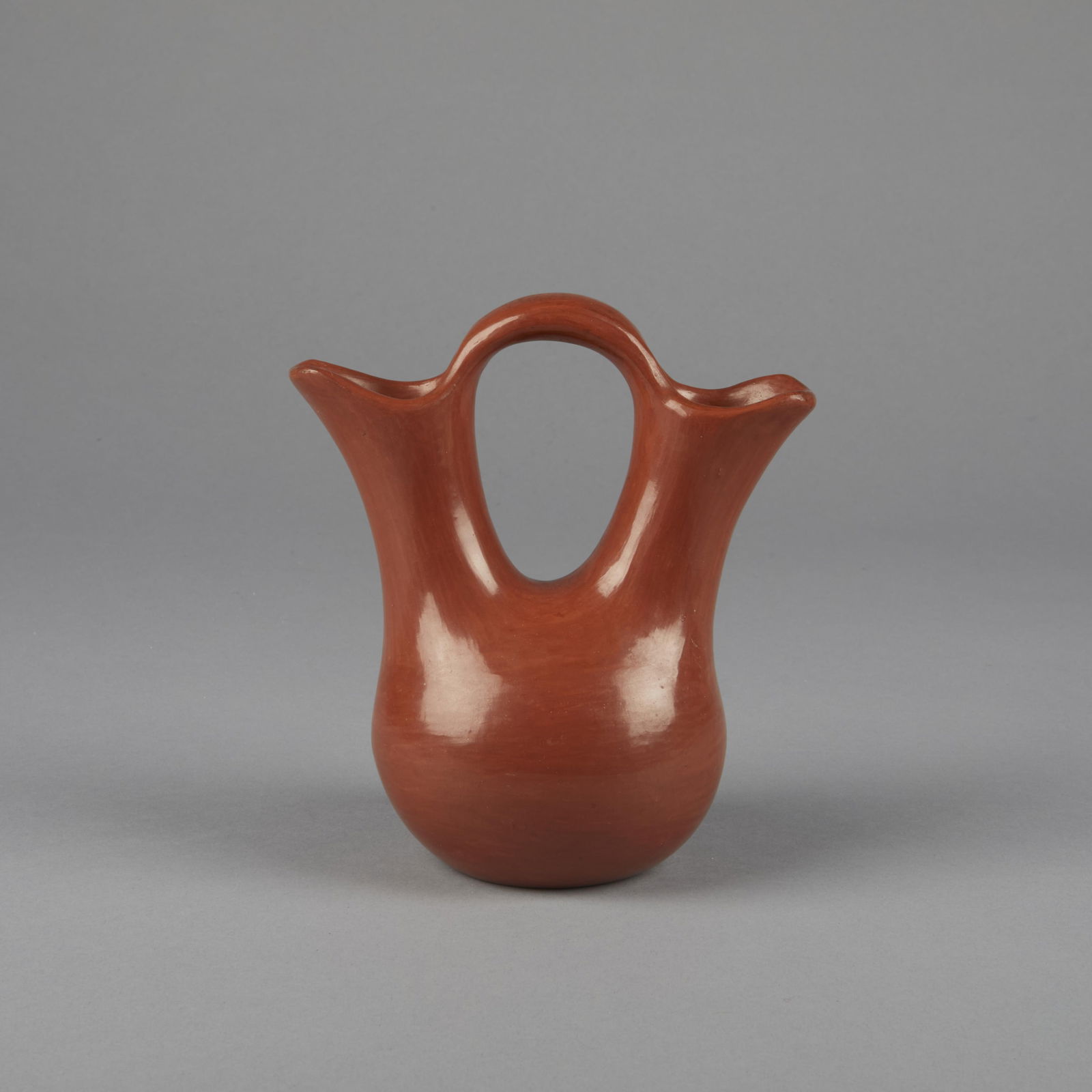 Margaret Tafoya, Redware Wedding Vase: Margaret TafoyaSanta Clara, 1904 - 2001Redware Wedding Vasefired clayinscribed: Margaret Tafoya6 1/2 x 5 7/8 x 3 3/4 in. (16.5 x 14.9 x 9.5 cm.) Private Collection, New Mexico