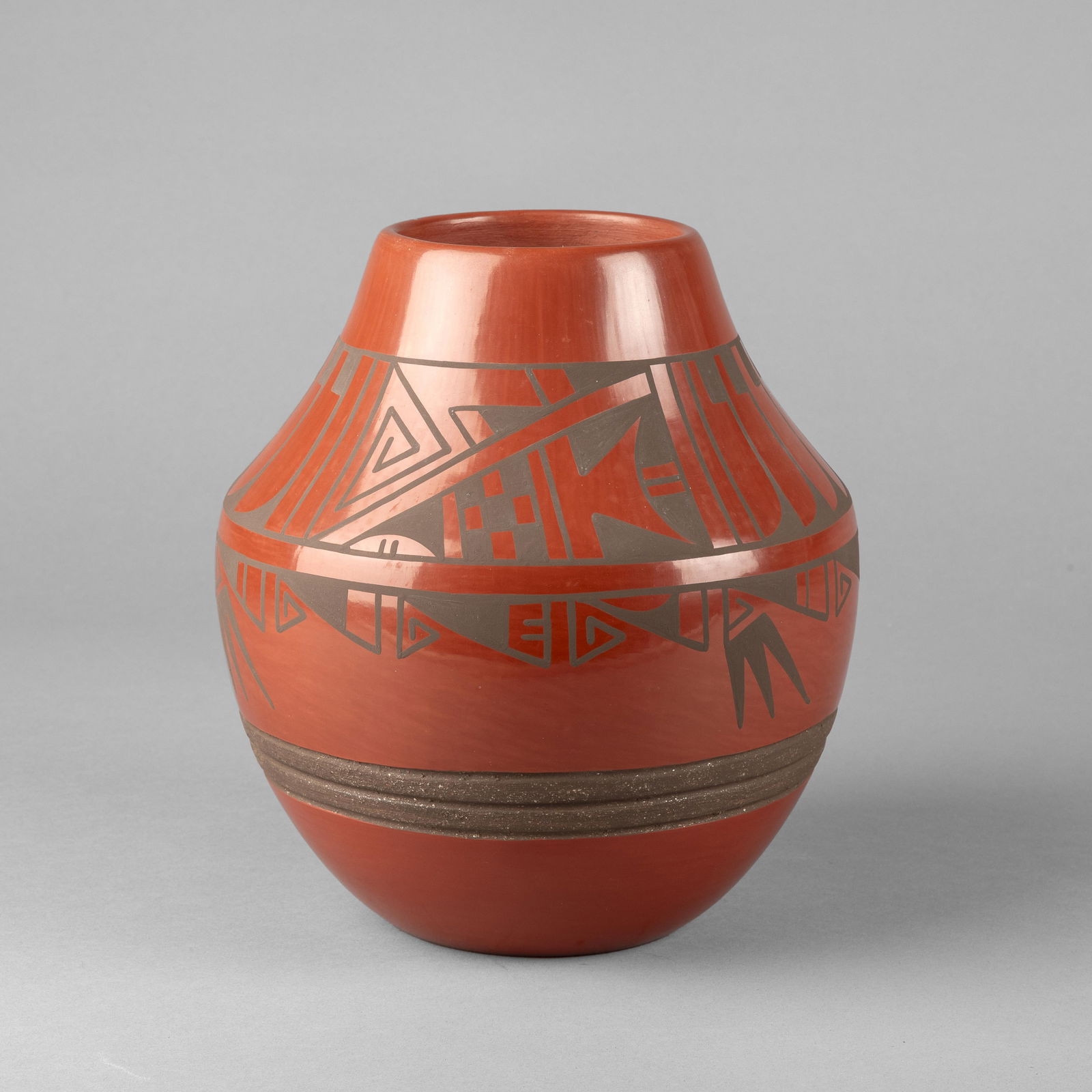 Eric Sunbird [Than Tsidéh] Fender, Redware Jar: Eric Sunbird [Than Tsidéh] FenderSan Ildefonso, b. 1970Redware Jarfired clay, micaceous clayinscribed: ThAN / TSidehheight: 8 1/2 x diameter 7 1/2 in. (21.6 x 19.1 cm.) The Larry Martine Collect