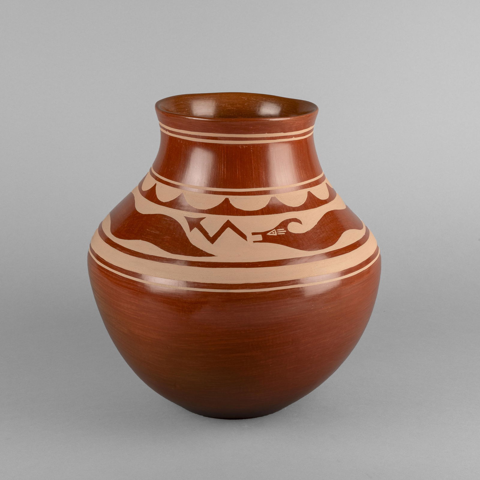 Lonnie Vigil, Redware Jar with Avanyu Design, 1986: Lonnie VigilNambe, b. 1949Redware Jar with Avanyu Design, 1986fired clayinscribed: Lonnie Vigil / Nambe Pueblo / 8/86height: 12 1/2 x diameter: 12 1/2 in. (31.8 x 31.8 cm.) Private Collection, N
