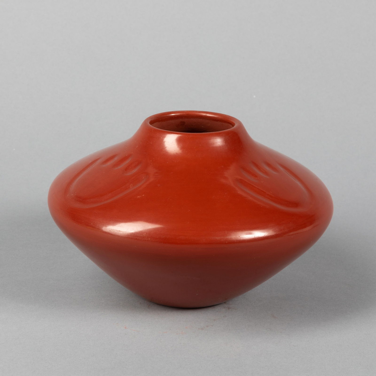 Tina Garcia, Redware Shouldered Jar with Bear Paw Designs: Tina GarciaOhkay Owingeh (San Juan) / Santa Clara, 1957 - 2005Redware Shouldered Jar with Bear Paw Designsfired clayinscribed: Tina Garcia / San Juan/ Santa / Clara4 3/4 x 7 in. (12.1 x 17.8 cm.)