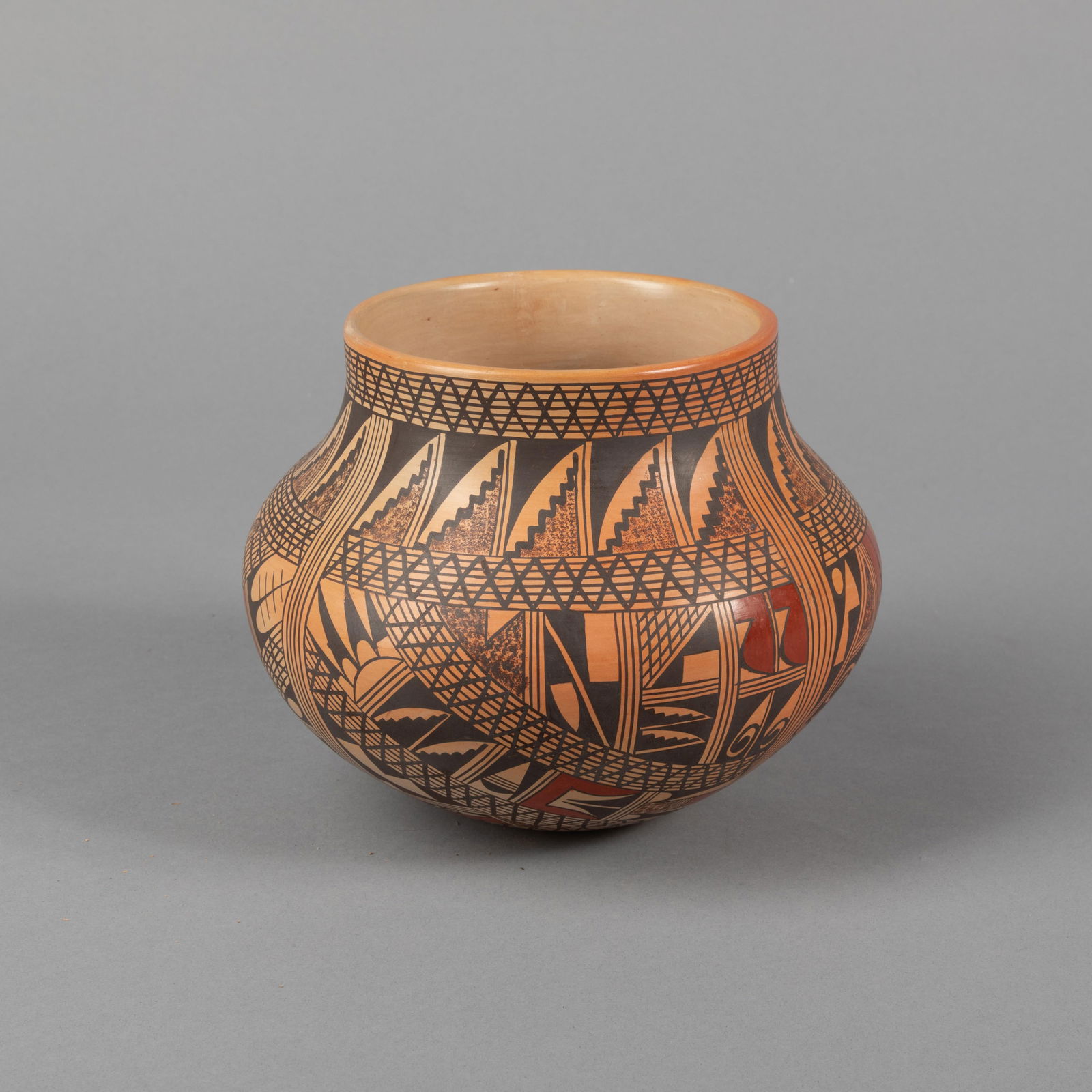 Rondina Huma, Polacca Jar with Polychrome Designs, ca. 1990: Rondina HumaHopi-Tewa, b. 1947Polacca Jar with Polychrome Designs, ca. 1990fired clay, natural pigmentsinscribed: R. Huma / Tewa Village / Polacca, / Azheight: 5 3/4 x diameter: 7 1/4 in. (14.6 x 18.4