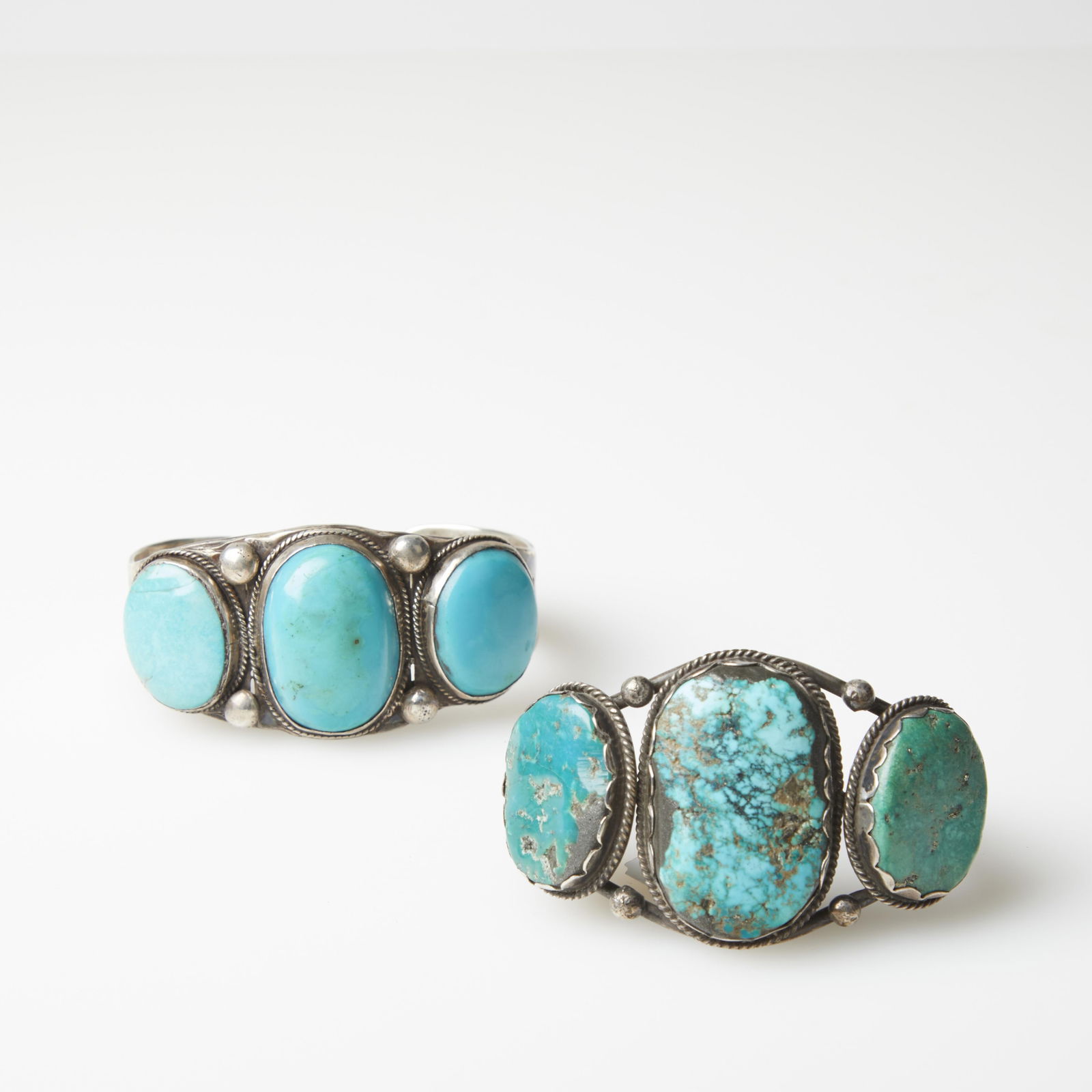 Diné (Navajo), Two Silver and Turquoise Cuff Bracelets, ca. 1940 - 1955: Diné (Navajo)Two Silver and Turquoise Cuff Bracelets, ca. 1940 - 1955silver, turquoiseStamped Silver Cuff Bracelet with Turquoise Cabochonssilver, turquoiseinternal circumference: 7 1/2 in. (19.1 cm.