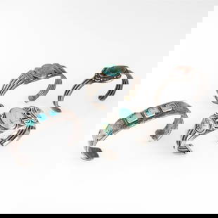 Attributed Diné (Navajo), Group of Four Silver Cuff Bracelets, ca. 1930 - 1960: Attributed Diné (Navajo)Group of Four Silver Cuff Bracelets, ca. 1930 - 1960silver, turquoise, petrified woodThree Square Turquoise Cuff Braceletinner circumference: 5 5/8 in. (14.3 cm.), gap: 1 5/8